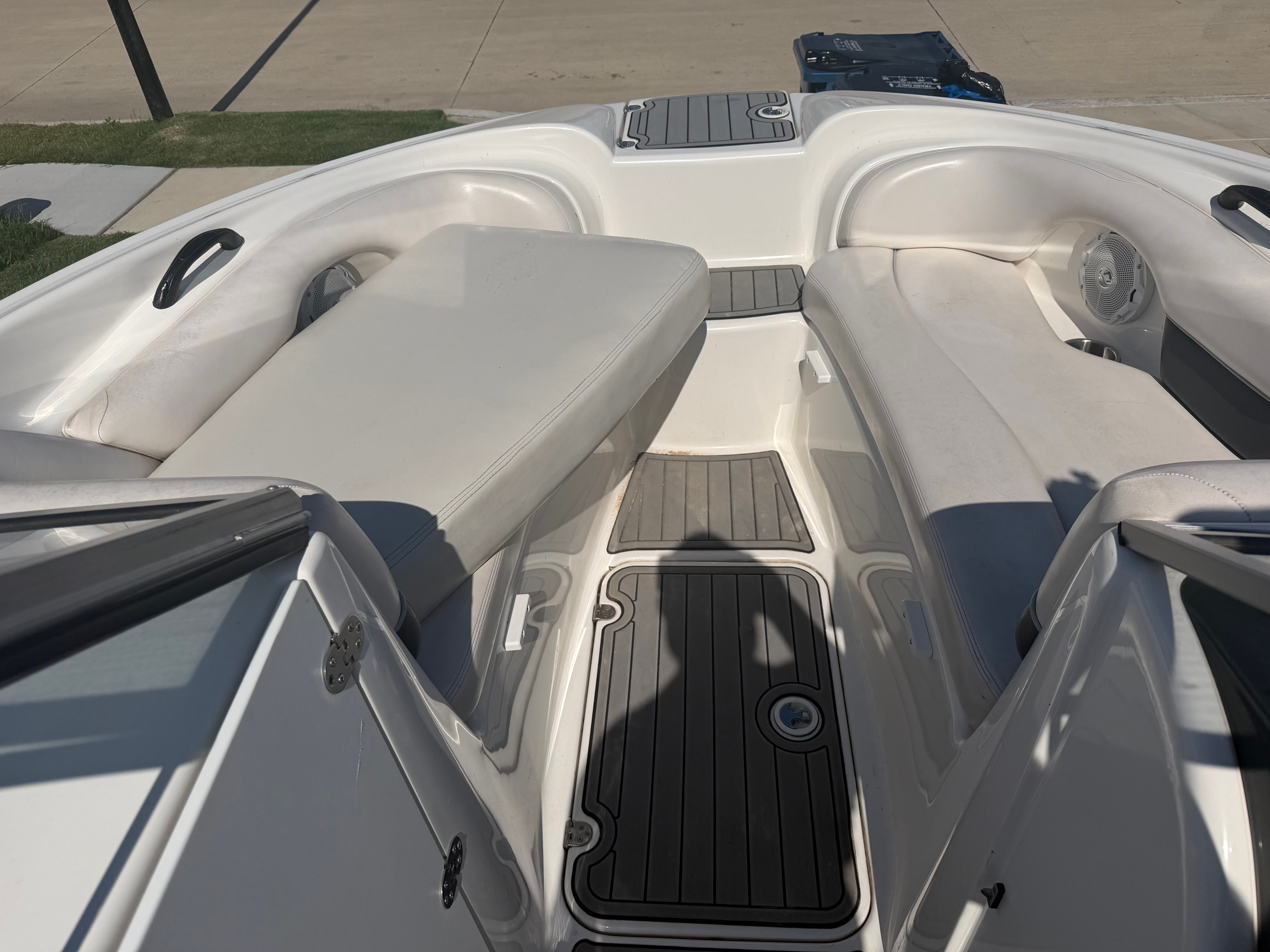 Interior of a 2006 Yamaha AR210 boat with white seating.