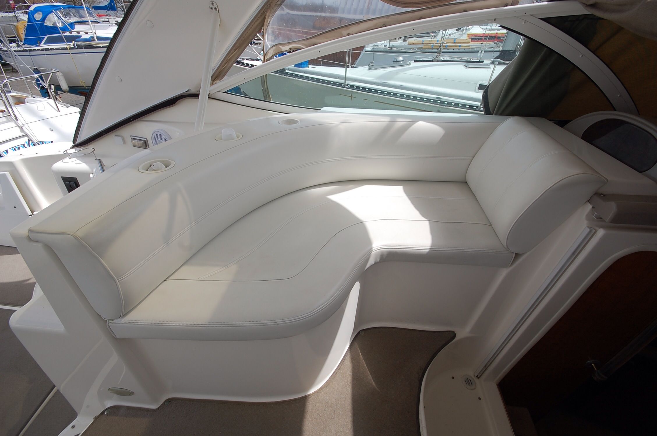 Interior of 2004 Cruisers Yachts 3970 with white leather seating.