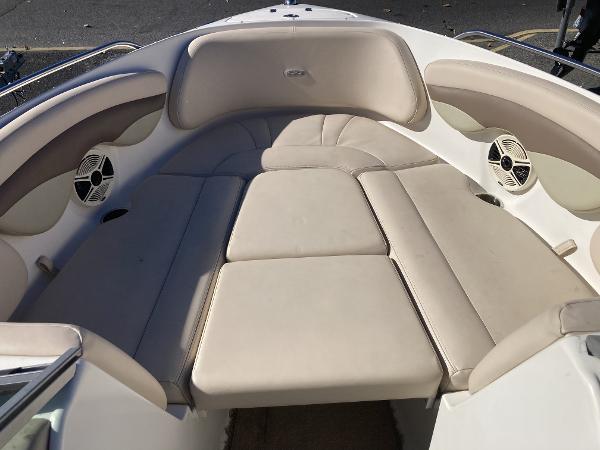 2008 Chaparral 210 SSi boat interior with beige seating and speakers.
