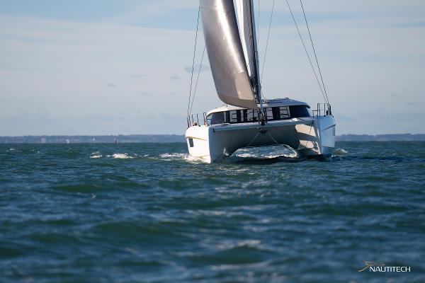 2025 Nautitech 48 Open catamaran sailing on open water.