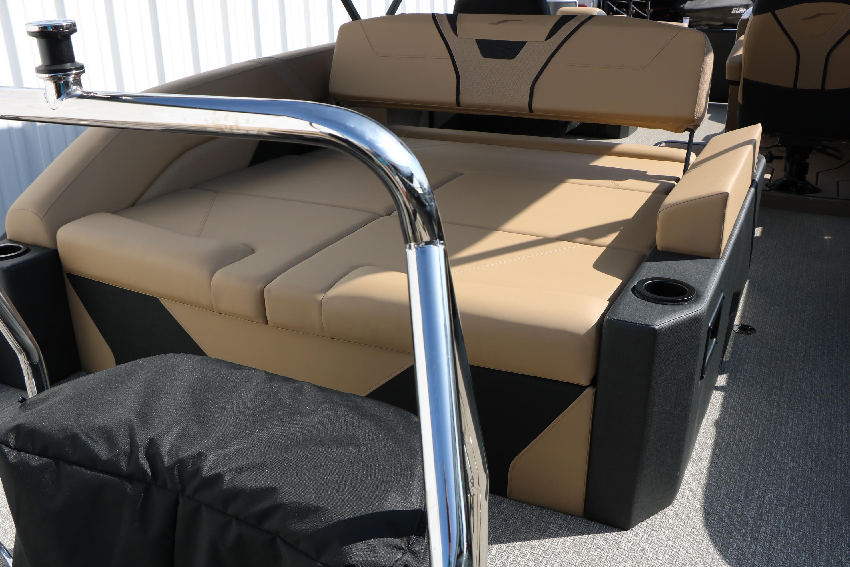 Luxurious seating on 2026 Evotti 723CS boat with beige upholstery and cup holders.