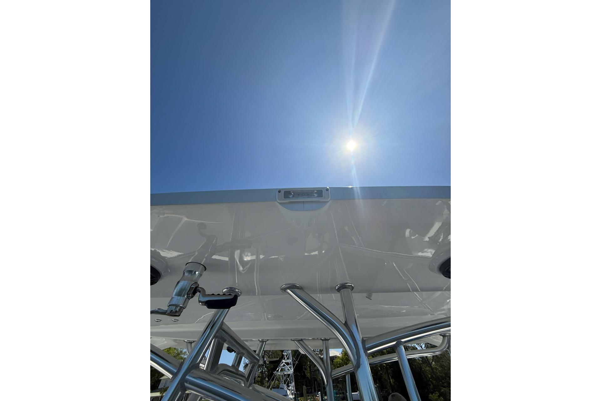 Custom Infusion 34 CC boat, 2021 model, viewed from below under a bright sunlit sky.