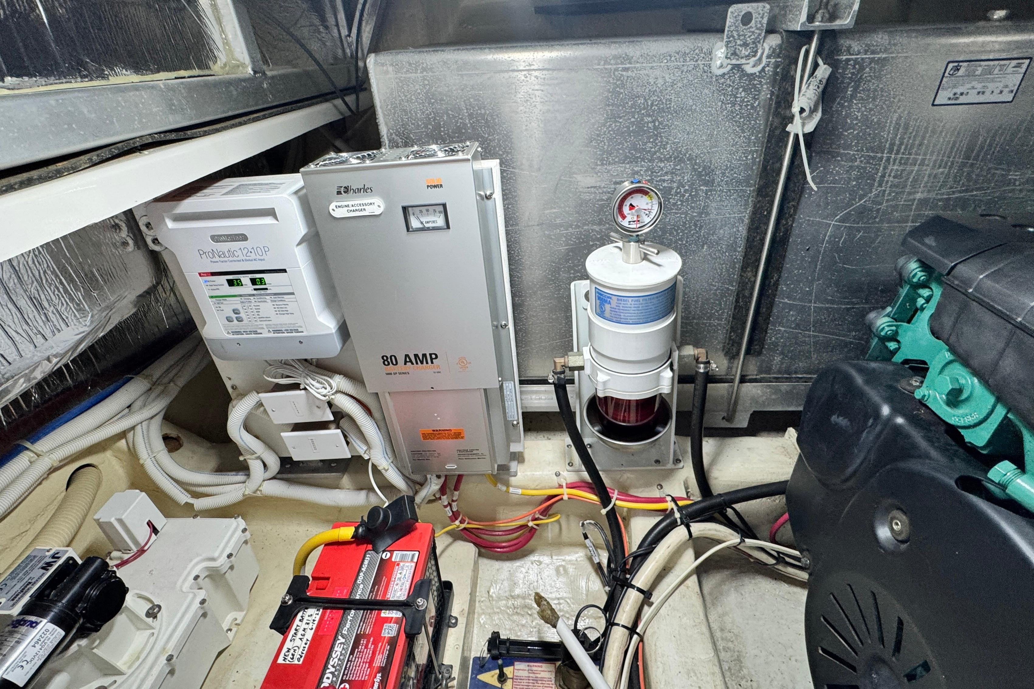 Engine room of a 2007 Carver 47 Motor Yacht with electrical components and wiring.