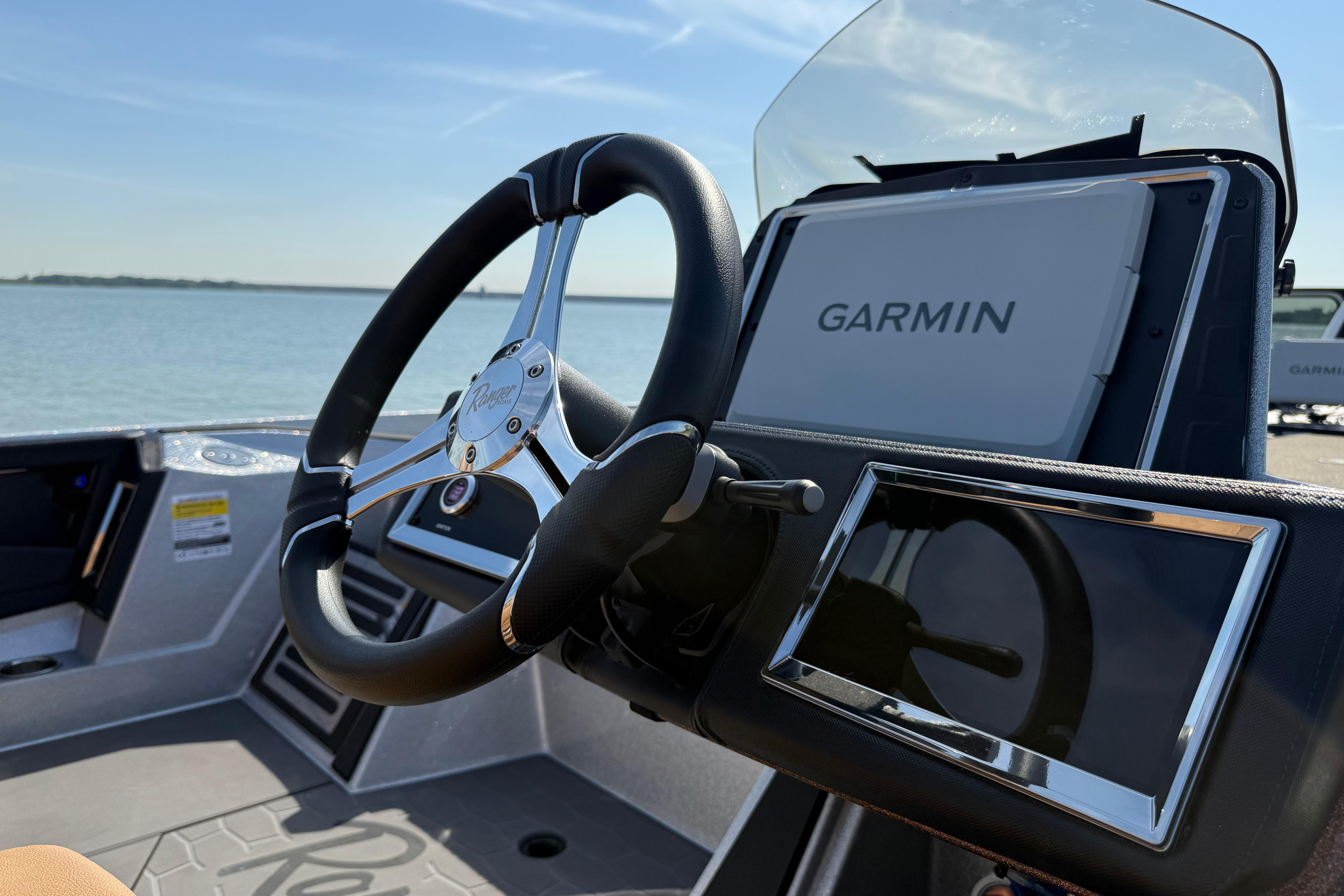 Steering wheel and Garmin display on 2026 Ranger Z521R boat dashboard.