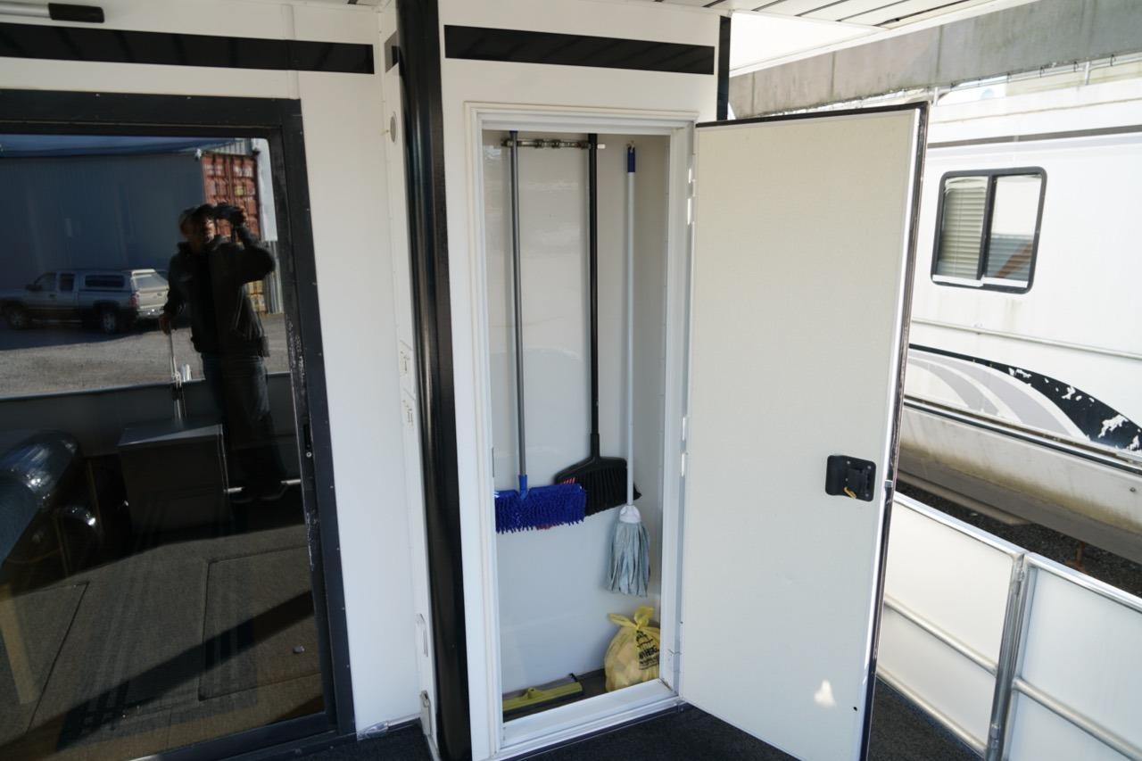 Storage closet on a 2000 Stardust Cruisers 83'x17' houseboat, containing cleaning supplies.