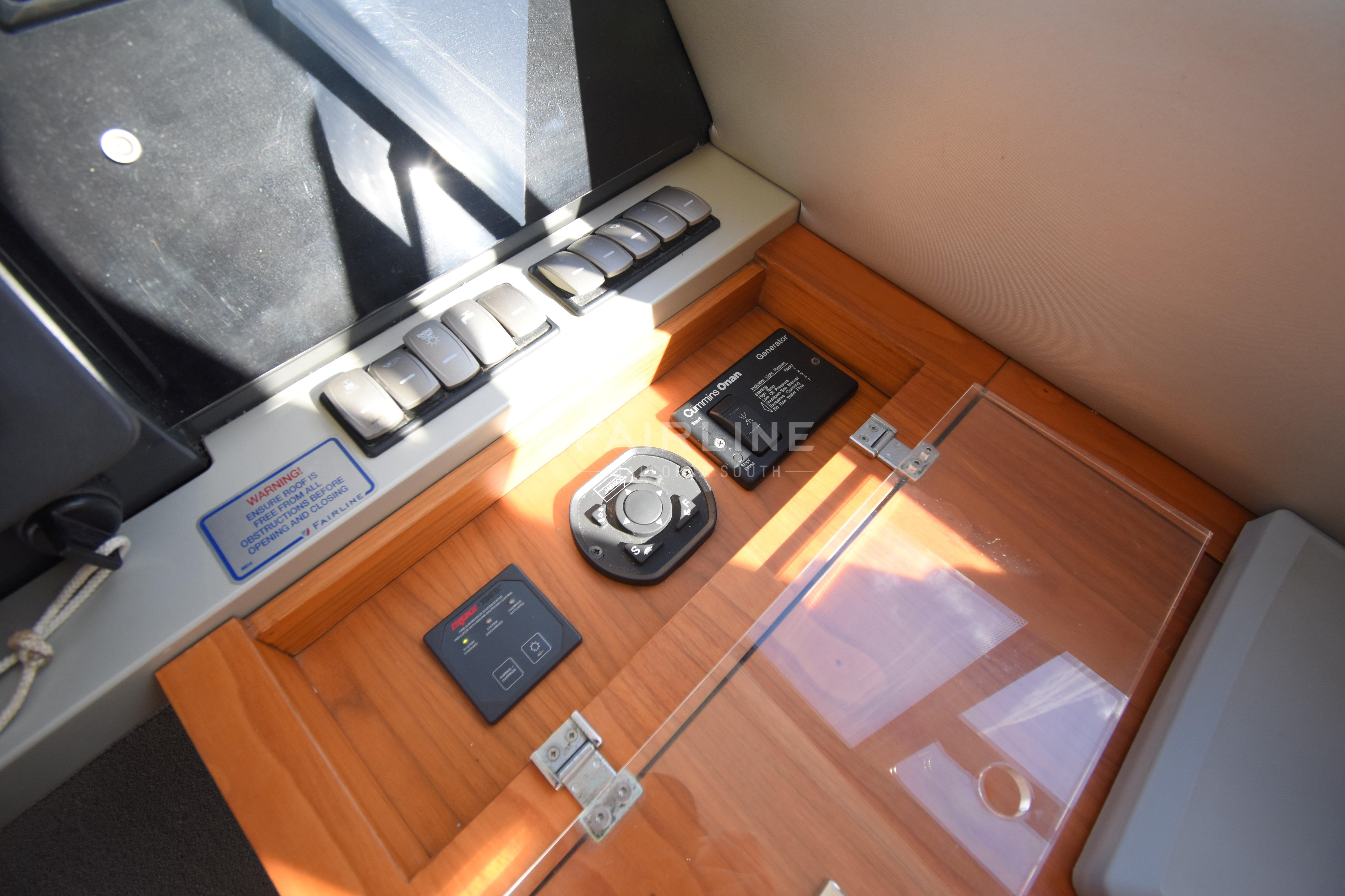 Control panel of 2012 Fairline Targa 50 GT yacht with switches and gauges.
