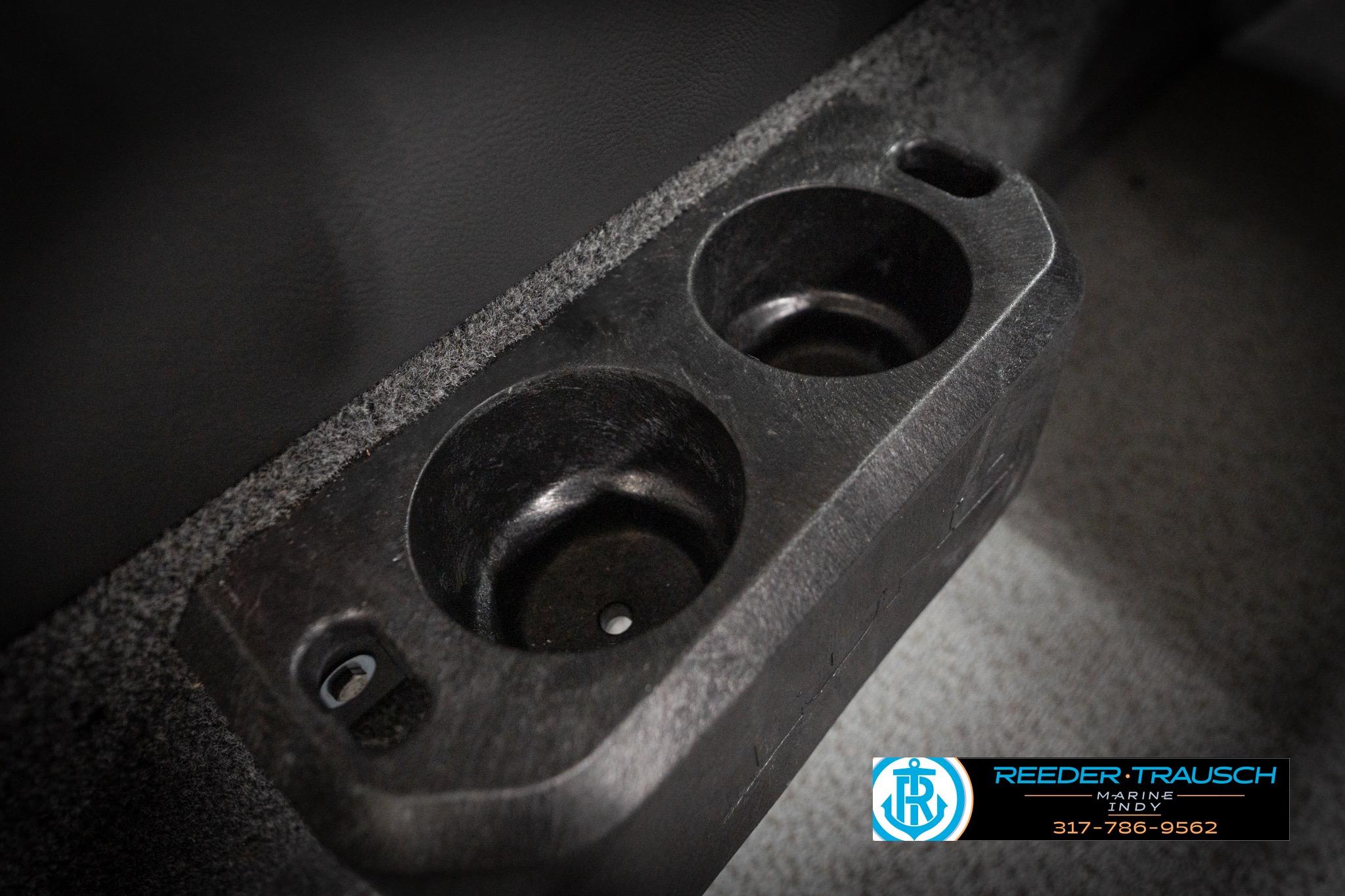 Cup holders in a 2026 Lund 2275 Baron boat interior, featuring Reeder Trausch Marine branding.