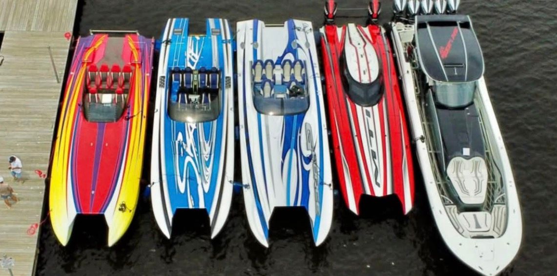 Five colorful speedboats docked, Skater 40 S.S. 2003 model.