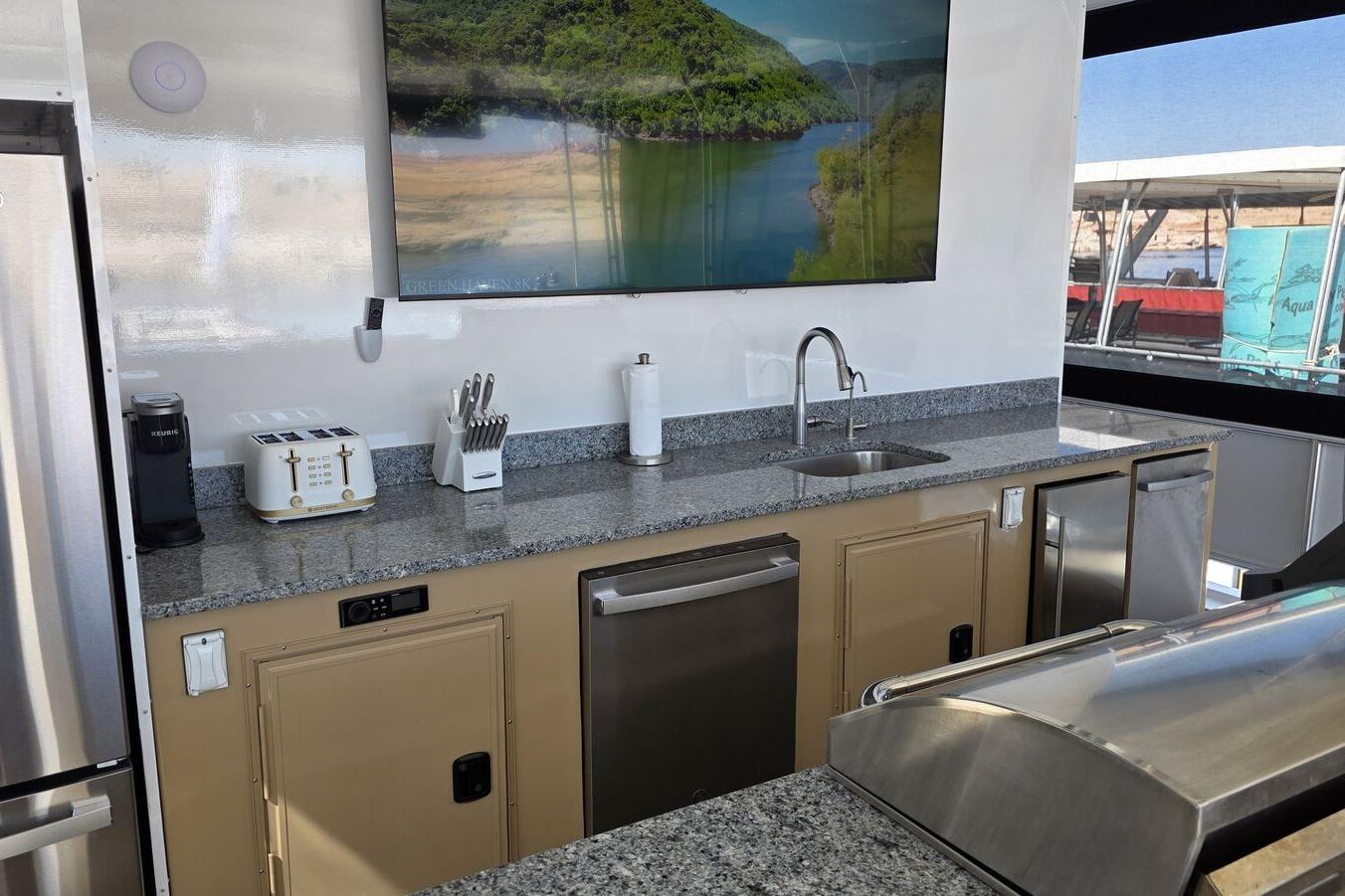 Modern kitchen on 2025 Sumerset Excellence Multiple Shares houseboat with granite countertops and appliances.