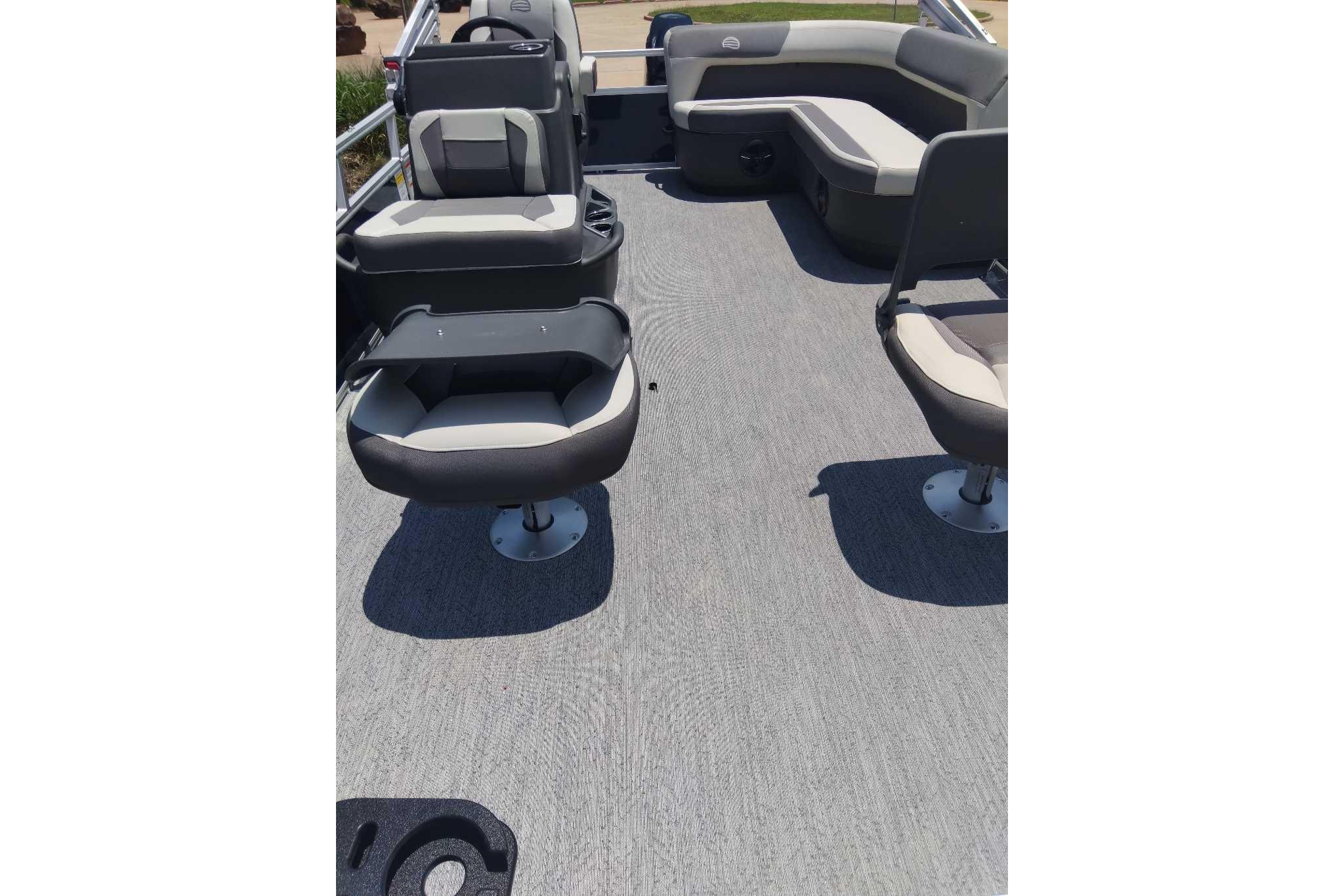 2026 Sun Tracker Bass Buggy 16 XL Select pontoon boat interior with seating and carpeted floor.