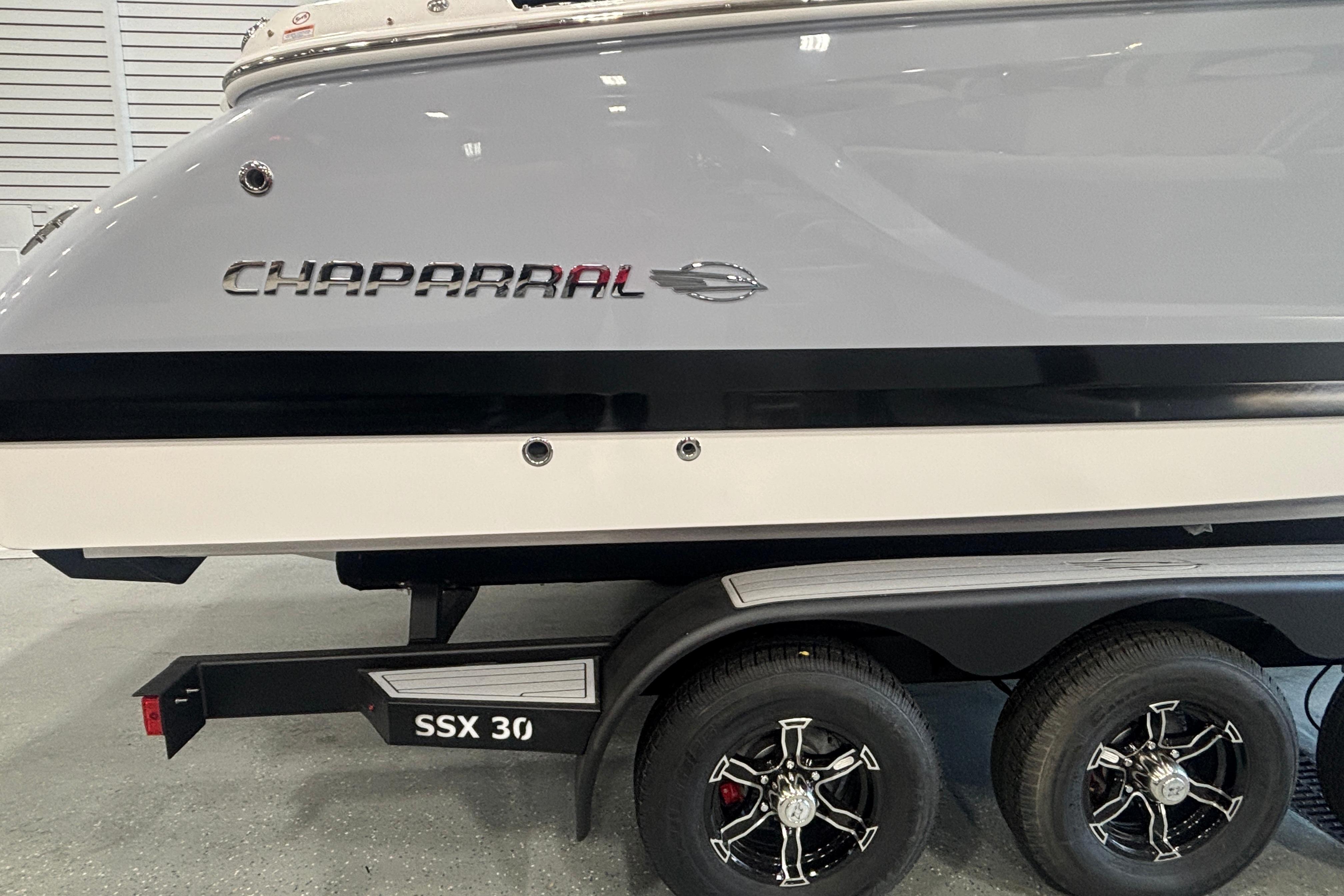2026 Chaparral SSX 30 boat on trailer, showcasing sleek design and branding.