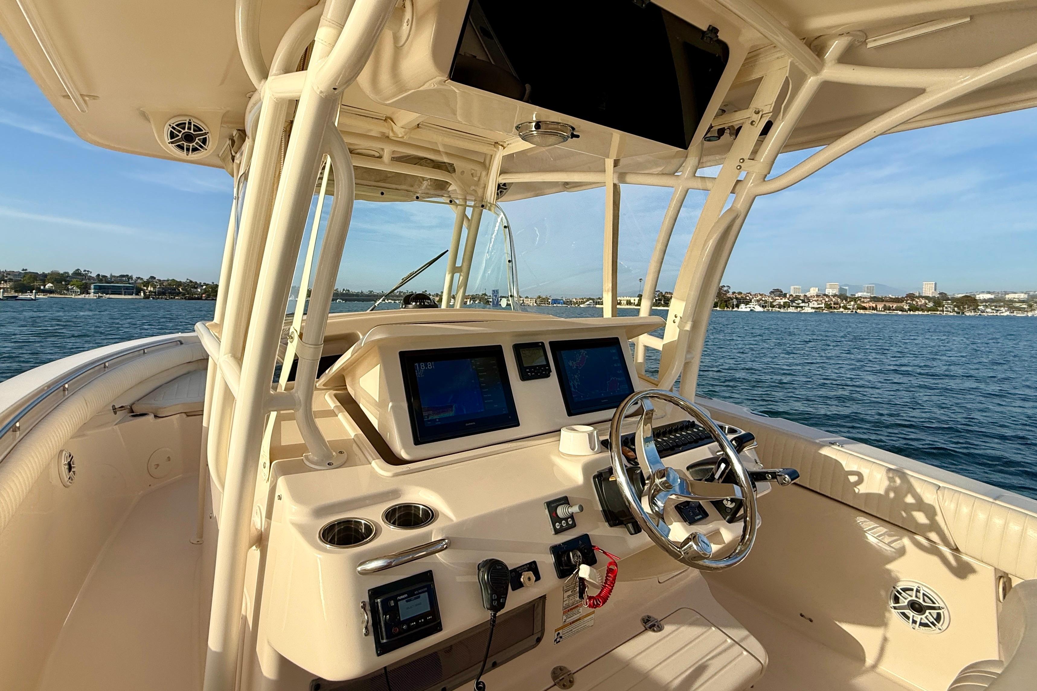2012 Grady-White Canyon 336 boat helm with modern controls on open water.
