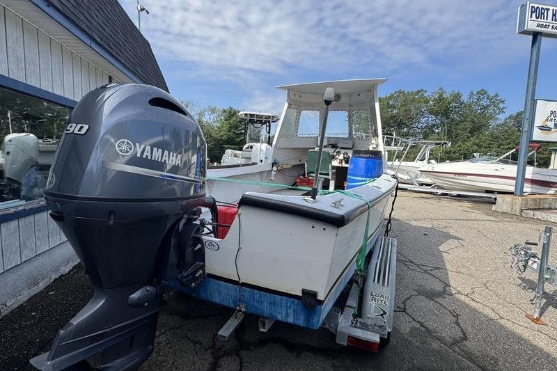 2001 ROS Boats 19 RUNABOUT with Yamaha 90 engine on trailer, parked outdoors.