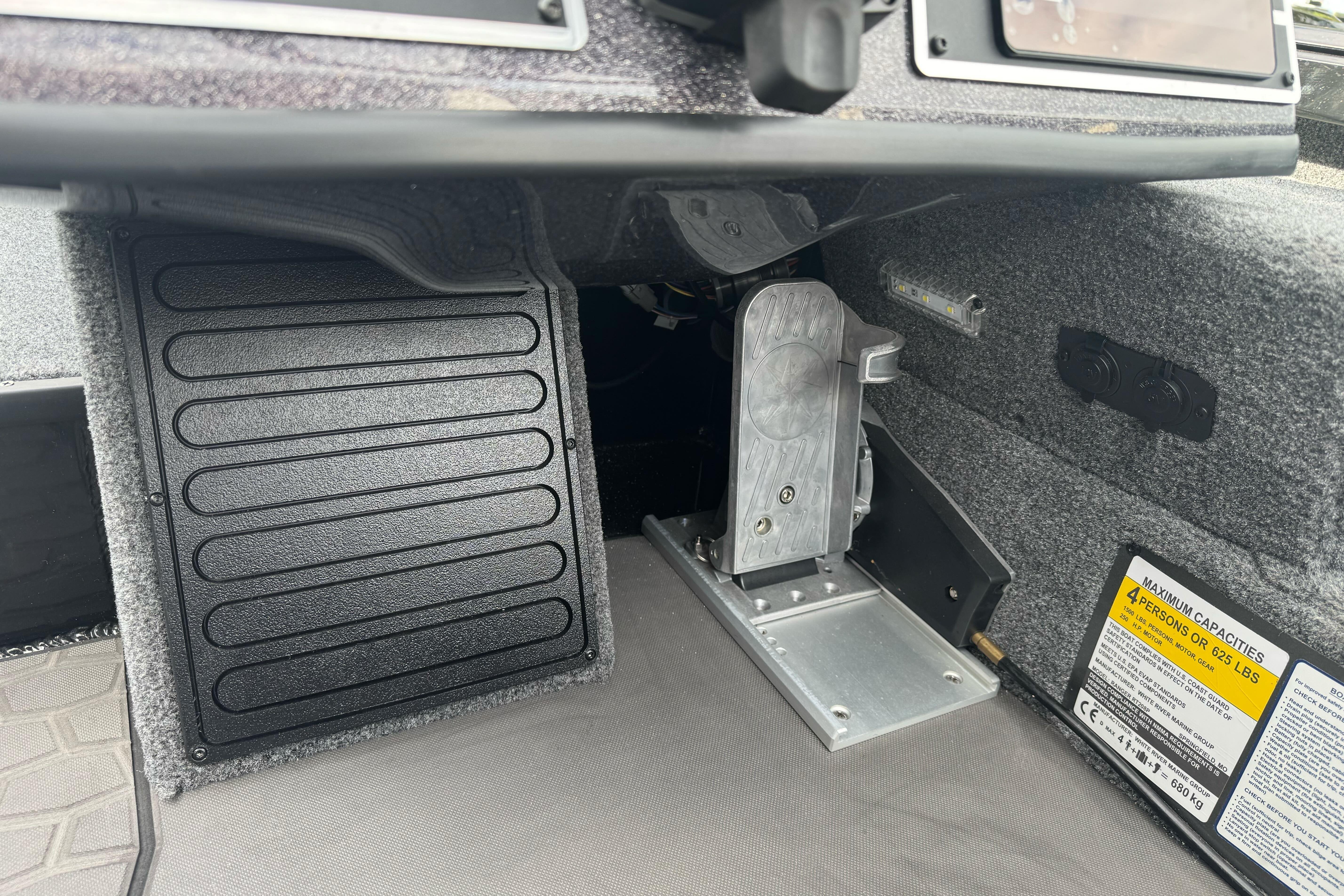 Interior view of 2026 Ranger ALPHA 208 boat, featuring foot pedal and control panel.