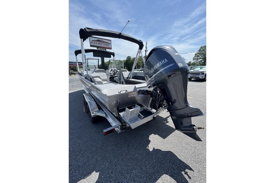 2025 SeaArk Super Lounge Easy boat with Yamaha outboard motor, parked outdoors.