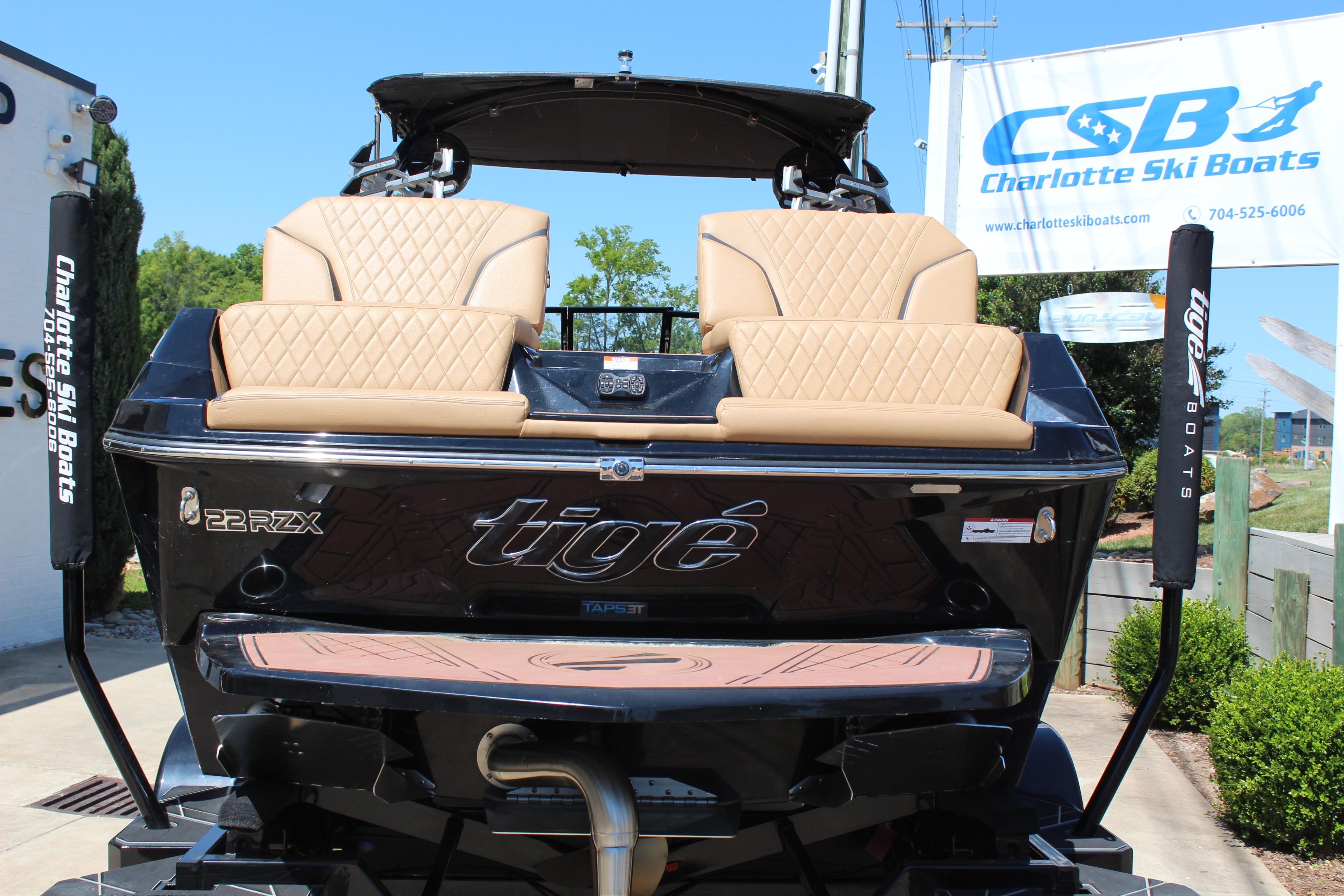 2022 Tigé 22RZX boat with tan seating at Charlotte Ski Boats dealership.