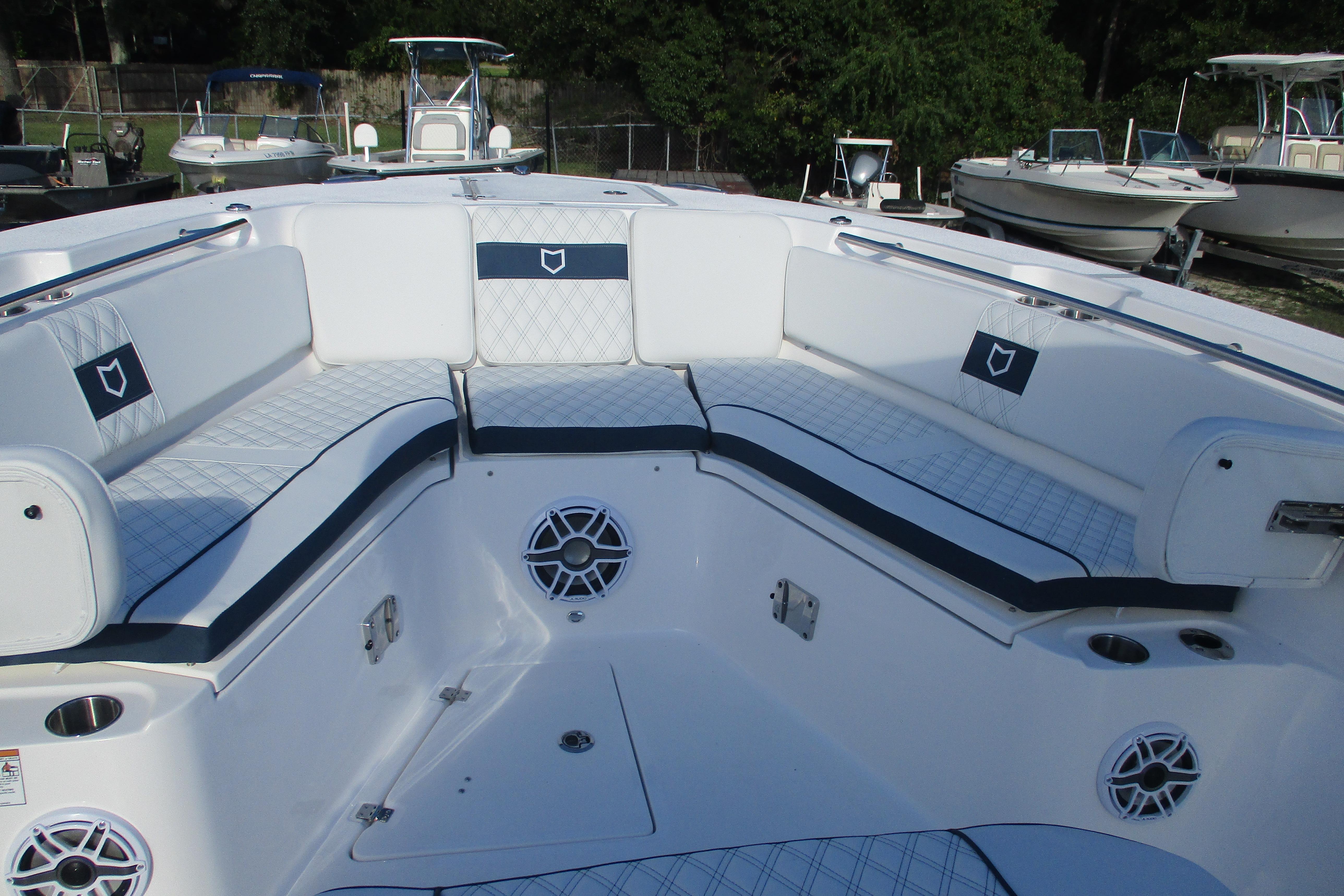 2026 Sea Fox 328 Commander boat interior with cushioned seating and speaker system.