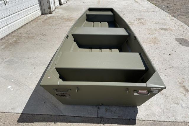 2026 Tracker Grizzly 14 Jon boat in olive green on concrete surface.