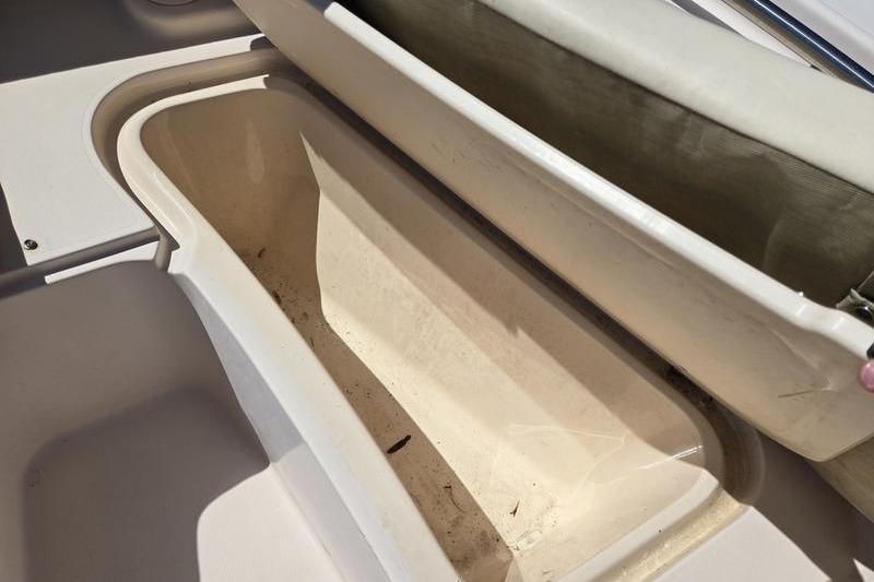 Open storage compartment on a 2007 Grady-White Tournament 205 boat.