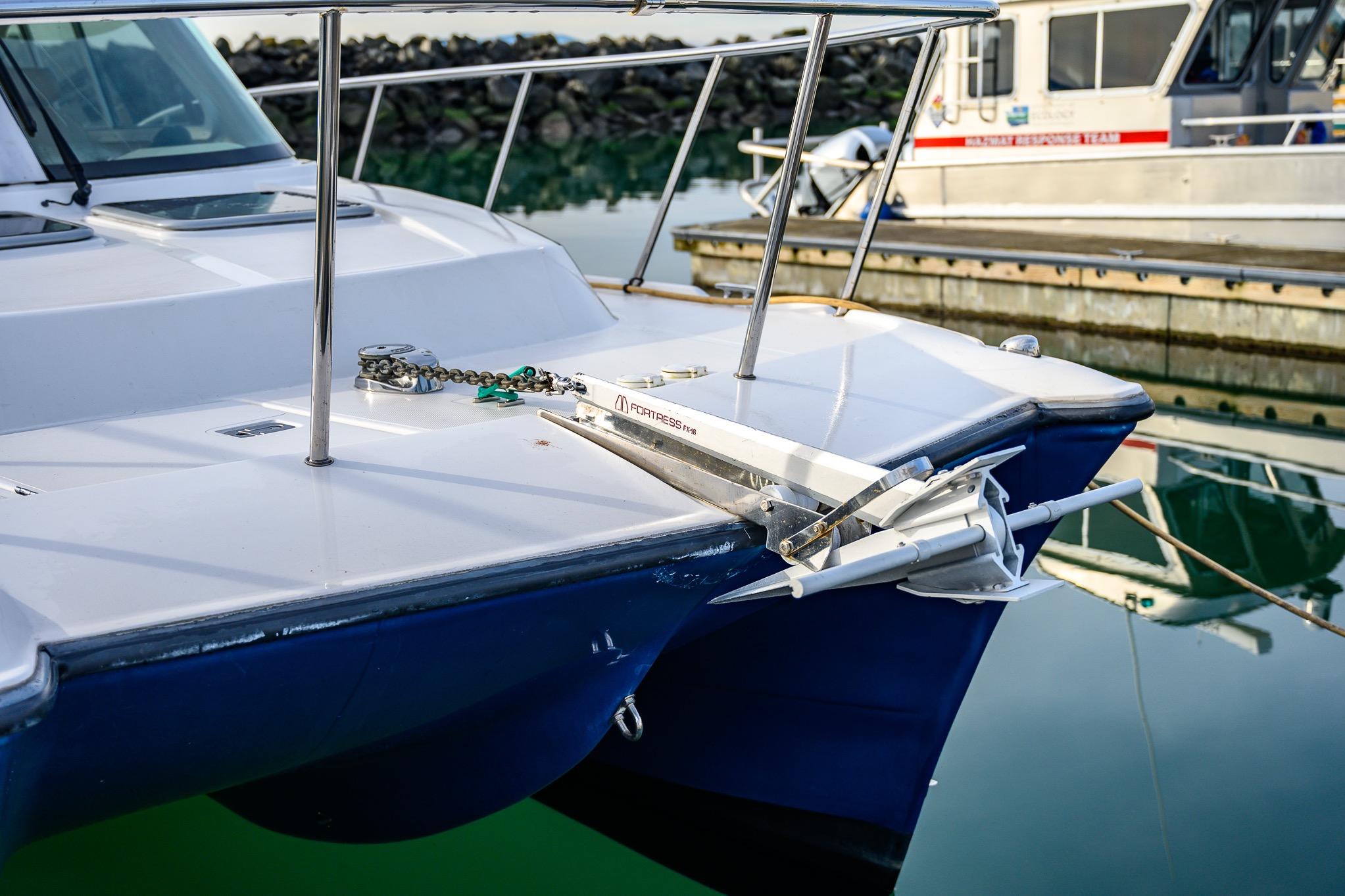 2012 Aspen C90 boat docked with anchor and chain visible.