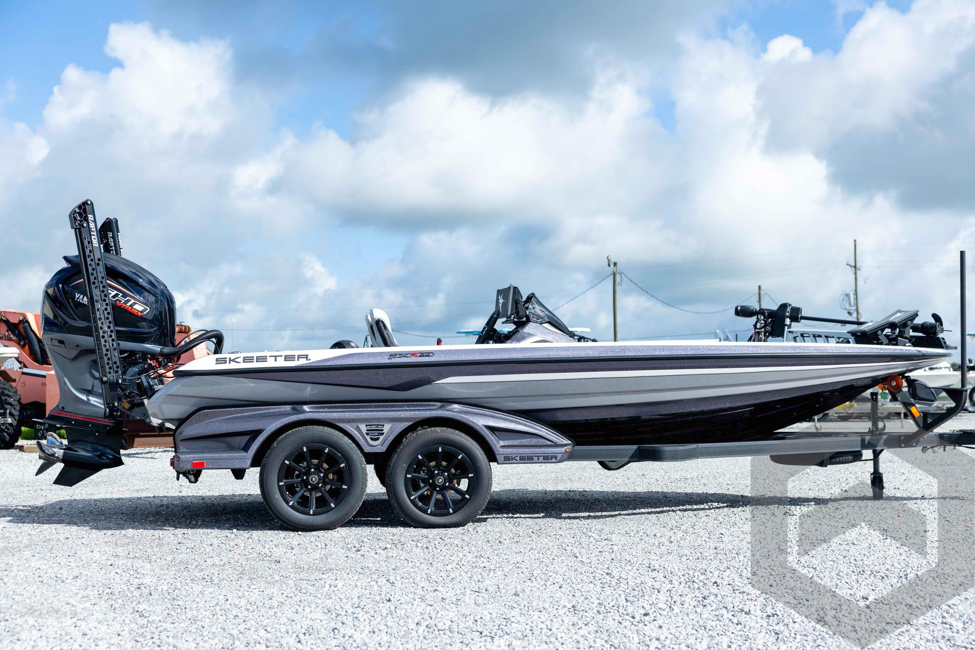2026 Skeeter FXR20 FLEX boat on trailer under a cloudy sky.