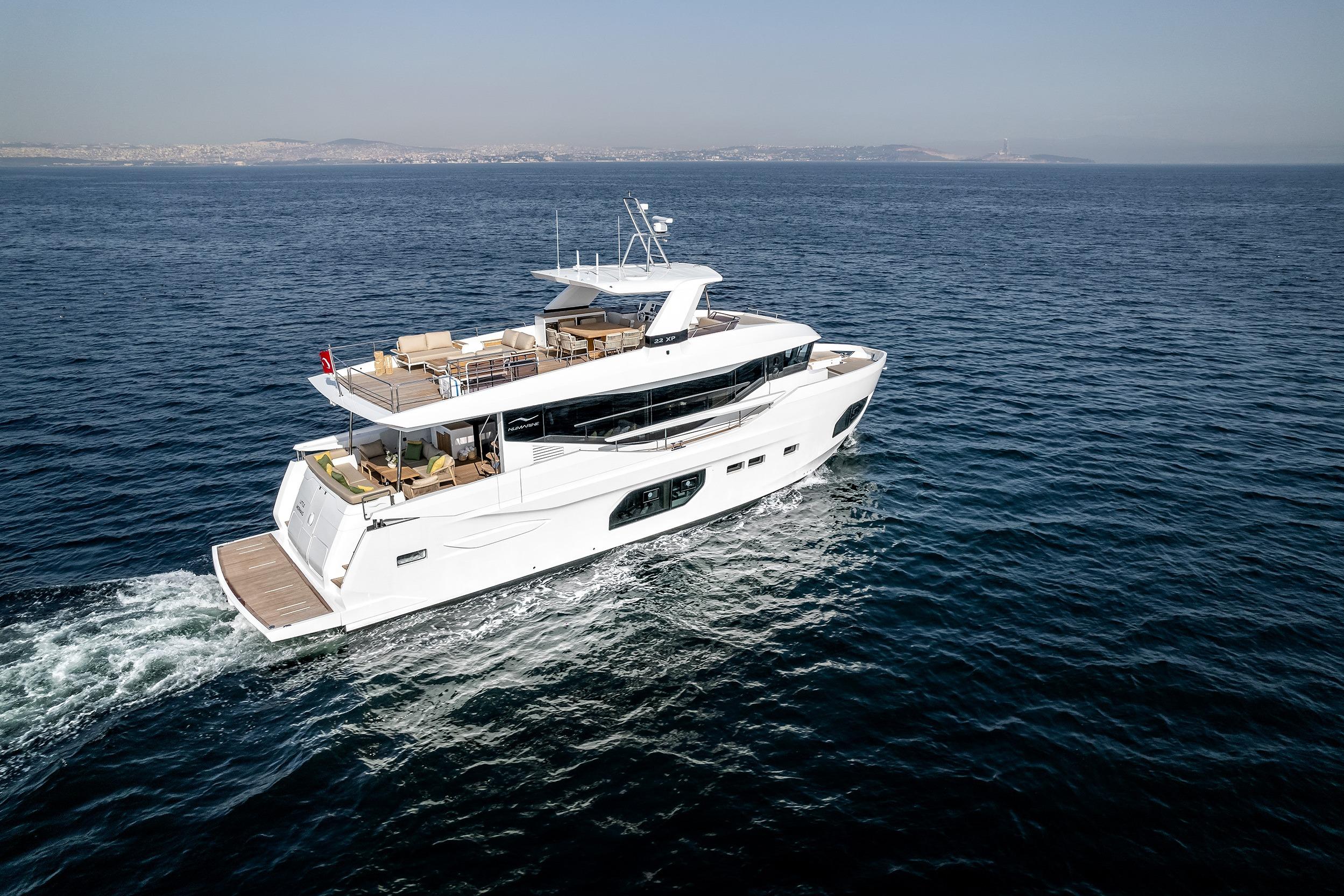 Luxurious 2025 Numarine 22XP yacht cruising on open sea.