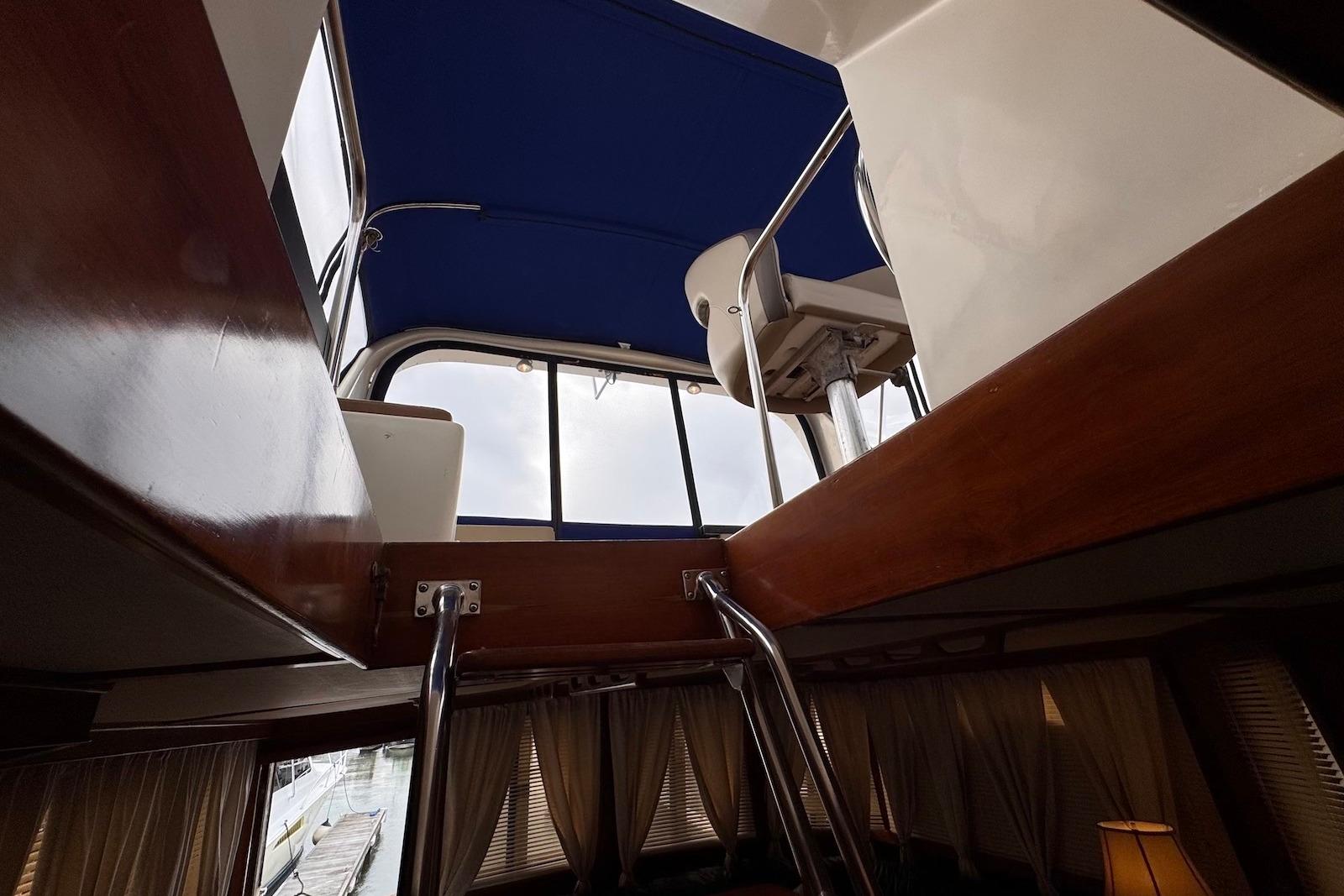 Interior view of 1988 Jefferson 52 Monticello yacht, showcasing upper deck and seating area.