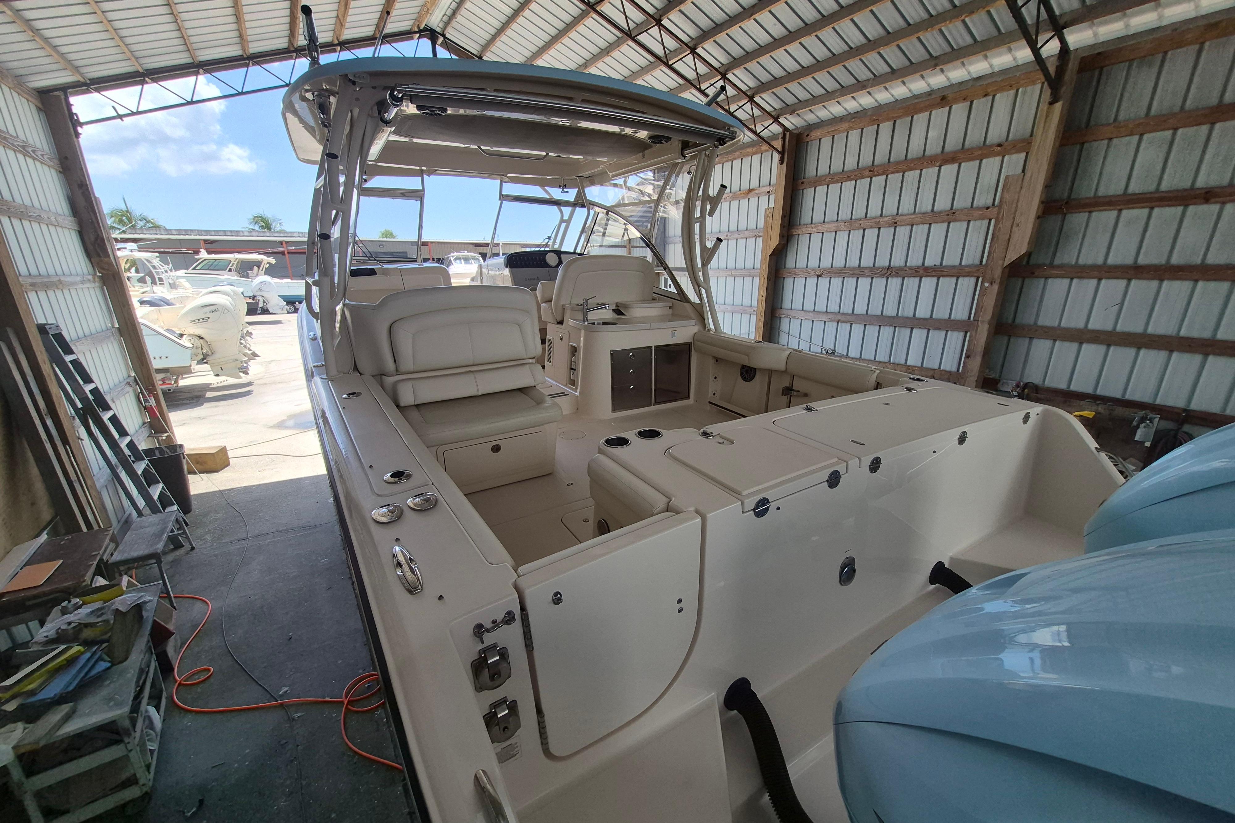 2019 Grady-White Freedom 335 boat in a covered storage area.