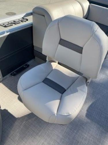 2024 Sun Tracker Fishin' Barge 20 DLX boat seat with gray upholstery.