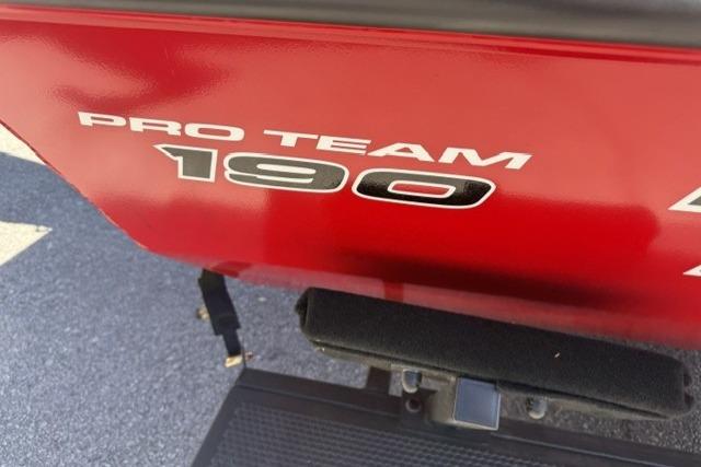2026 Tracker Pro Team 190 boat, red exterior, close-up view.
