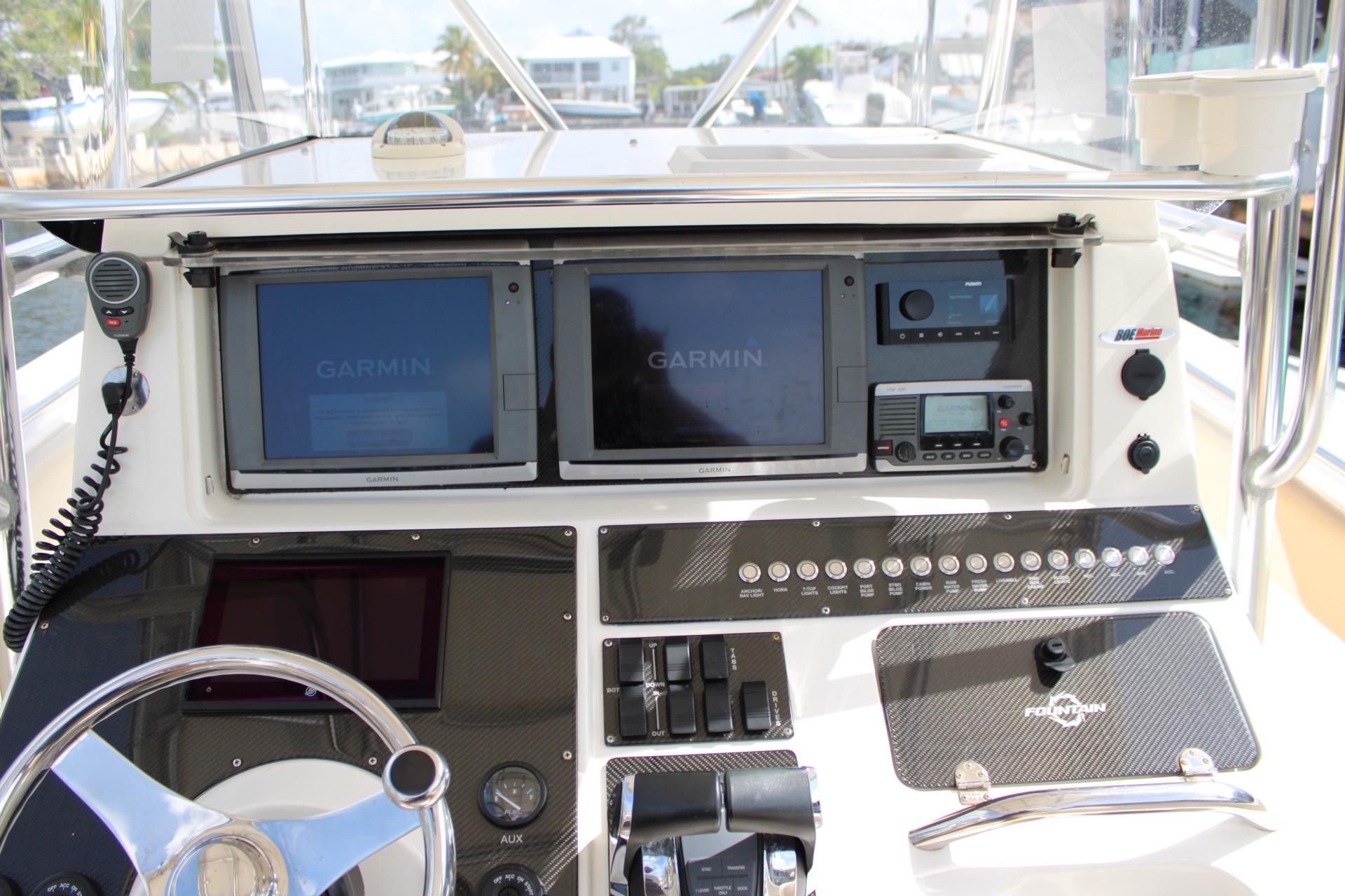 Center console of a 2007 Fountain 34 boat with Garmin navigation displays.