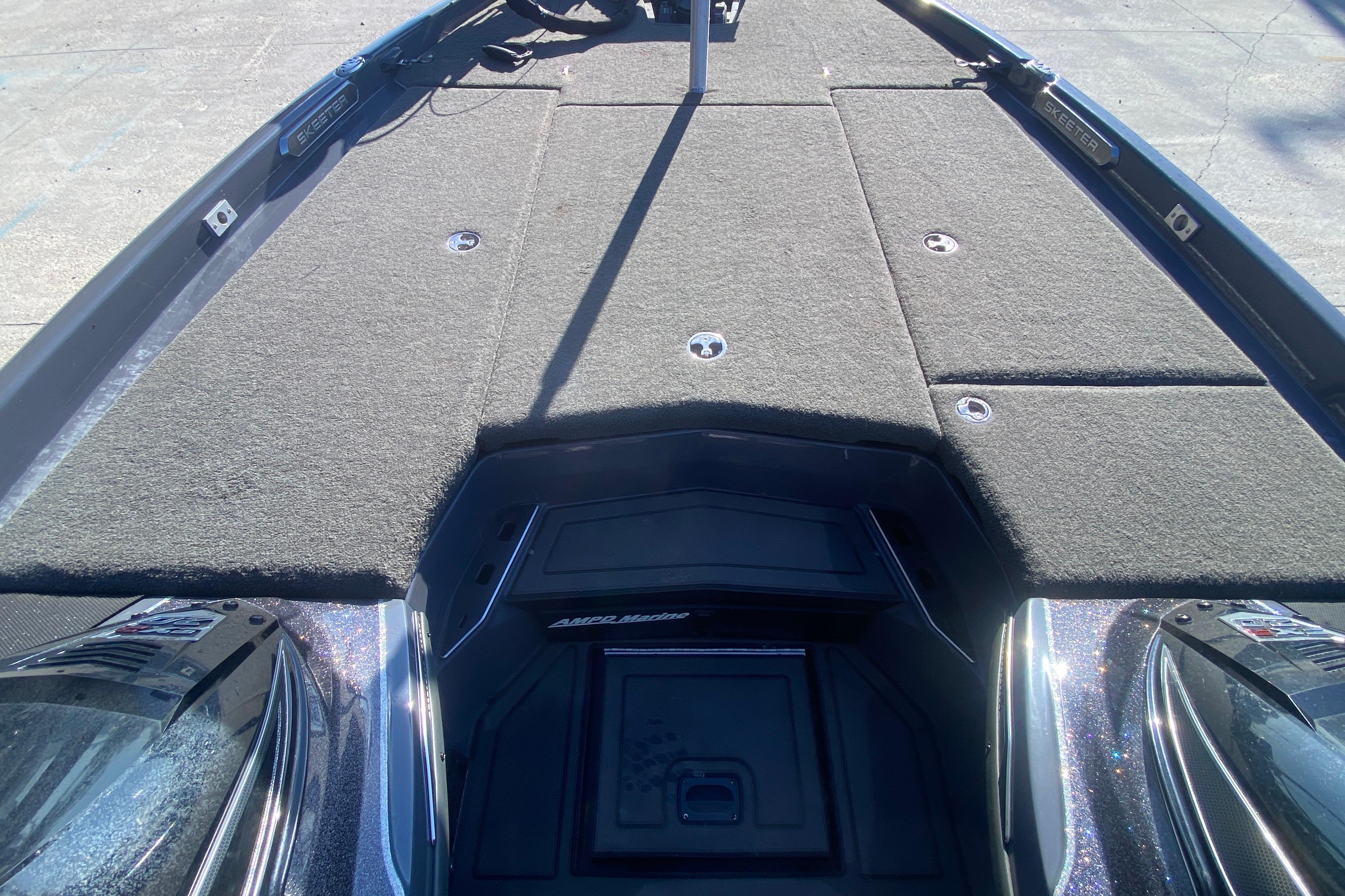 2020 Skeeter FXR20 Limited boat deck with carpeted storage compartments.