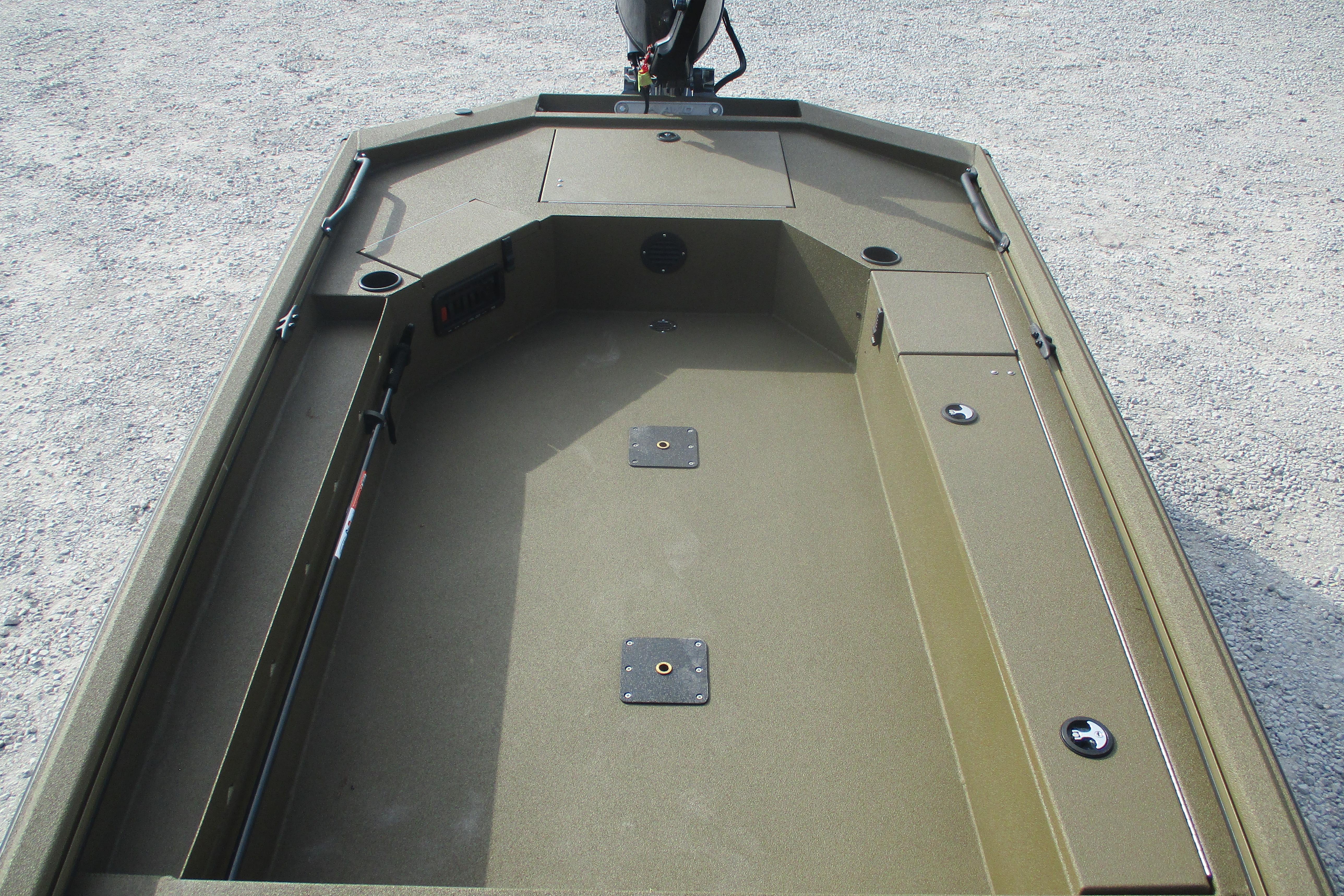 2026 Avid 16 Commander boat interior with storage compartments and fishing rod holder.