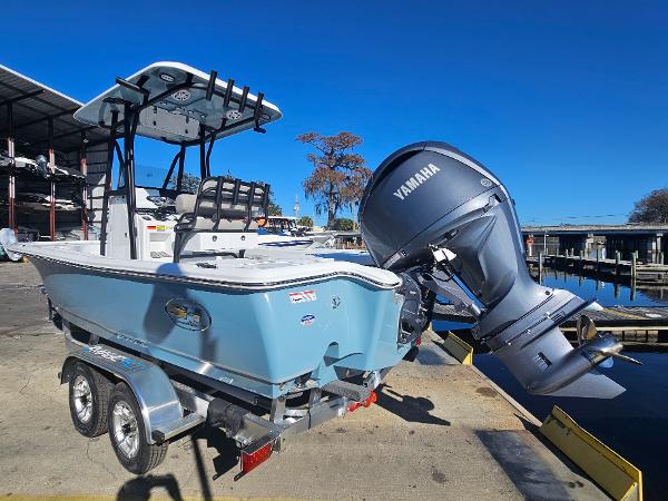 2026 Sea Hunt BX 22 BR boat with Yamaha engine on trailer, dockside.