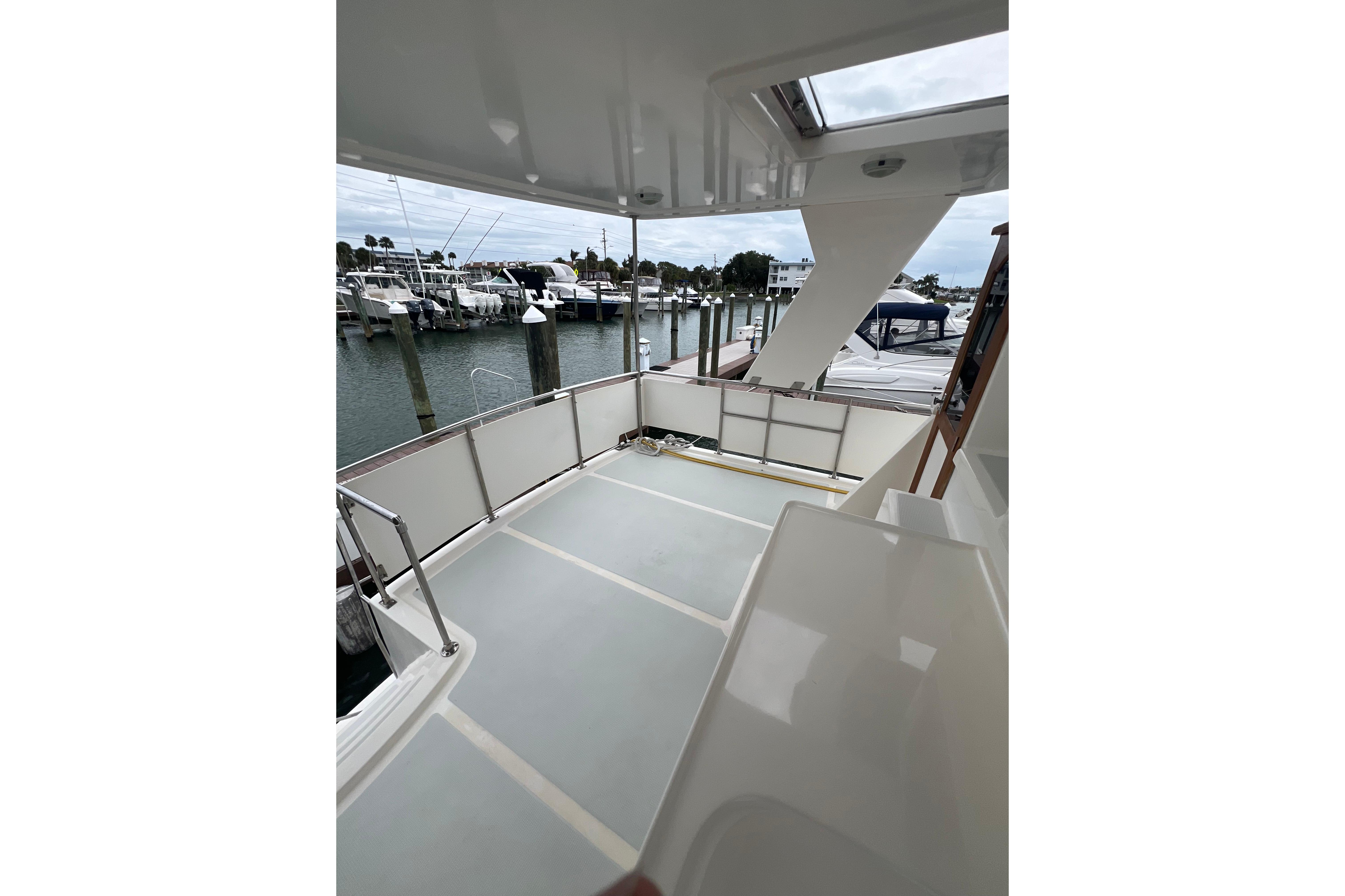 2007 Heritage East 36 Sundeck Trawler, spacious deck view at marina.