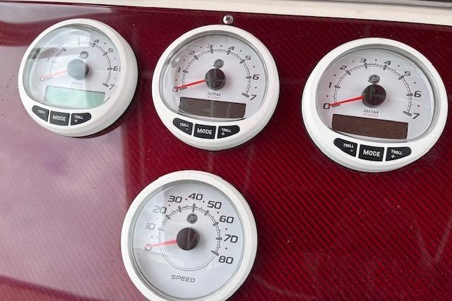 Instrument panel of 2001 Fountain 38 Center Console with RPM and speed gauges.