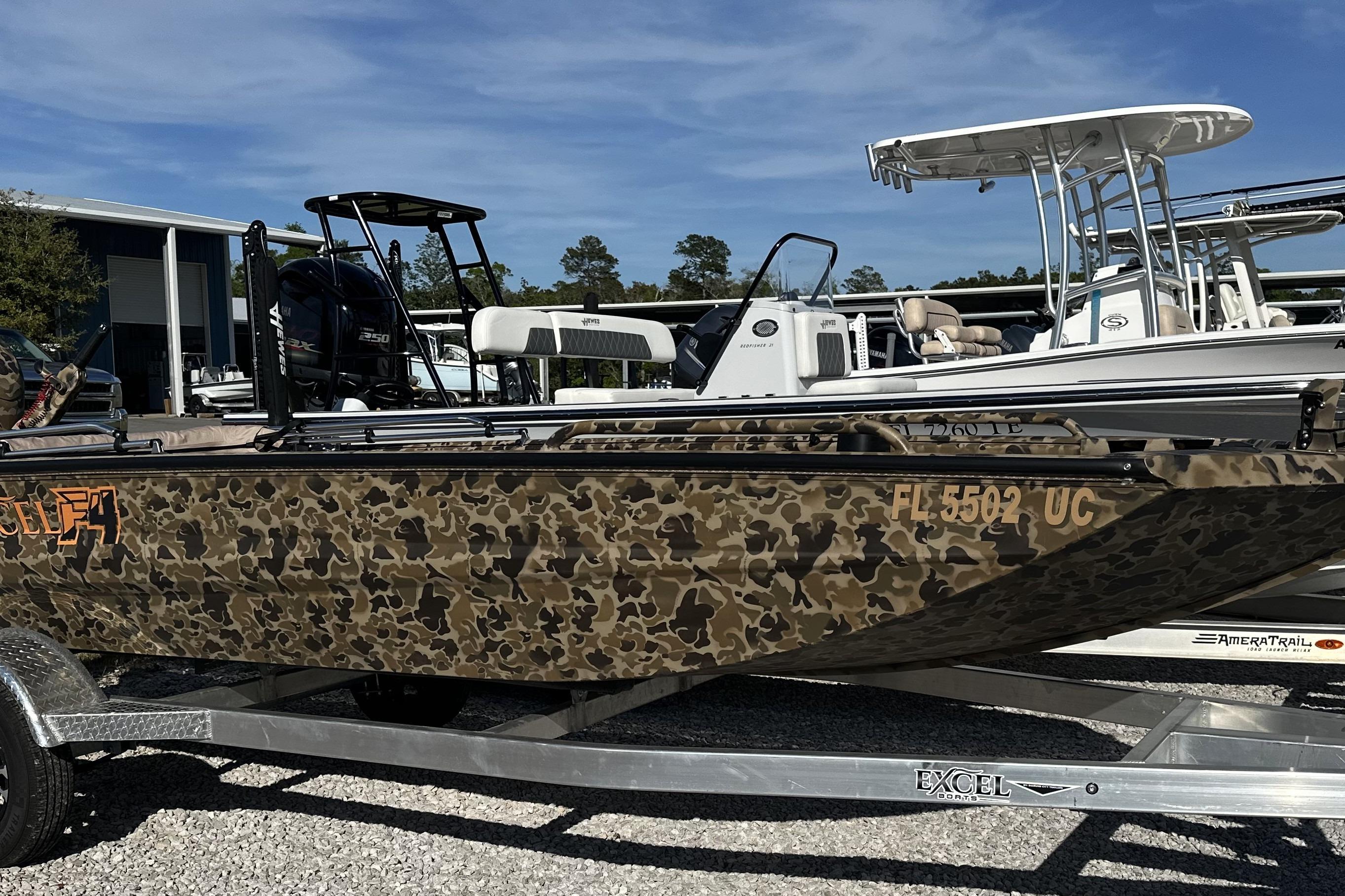 2026 Excel 1751 Viper F4 boat with camouflage design on a trailer.
