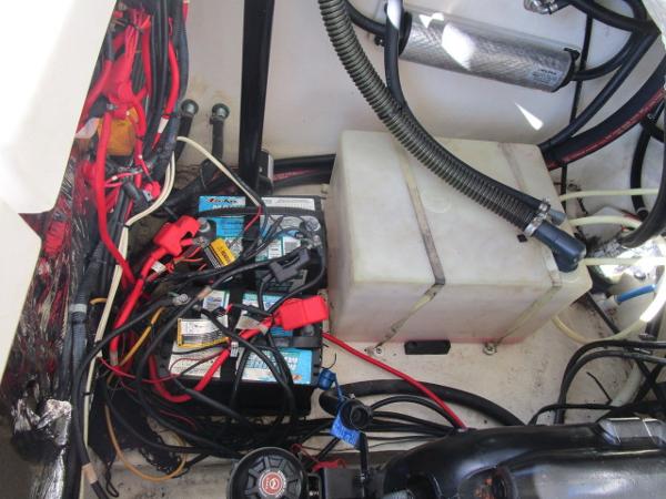 Engine compartment of 2017 Larson 292 LXI with battery and wiring.