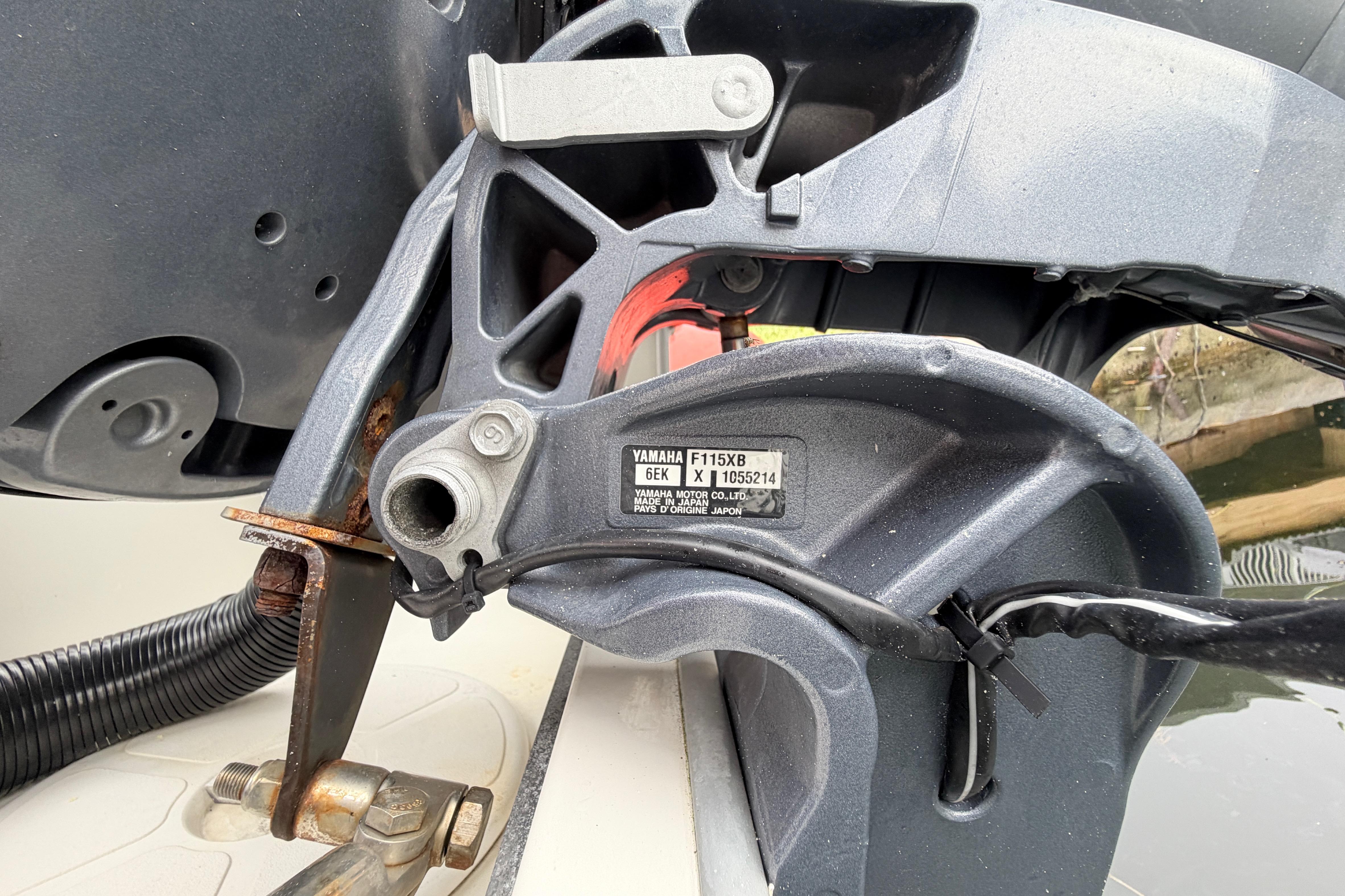 Close-up of a Yamaha F115XB engine part on a 2019 World Cat 230 DC boat.