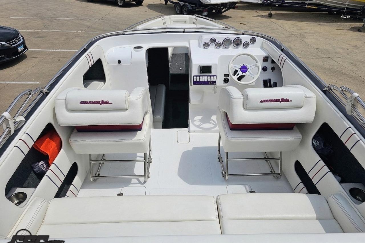 2019 Advantage 25 Citation Bowrider interior with white seating and modern dashboard.