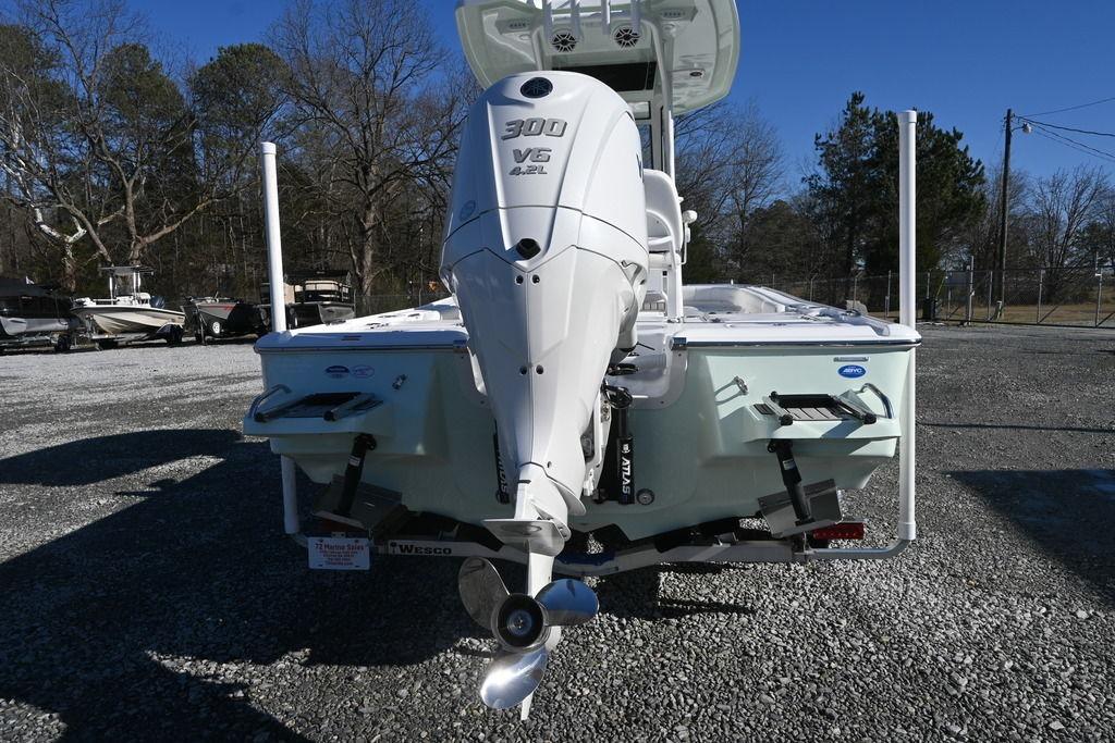 2026 Tidewater 2500 Carolina Bay boat with powerful 300 V6 engine, parked outdoors.