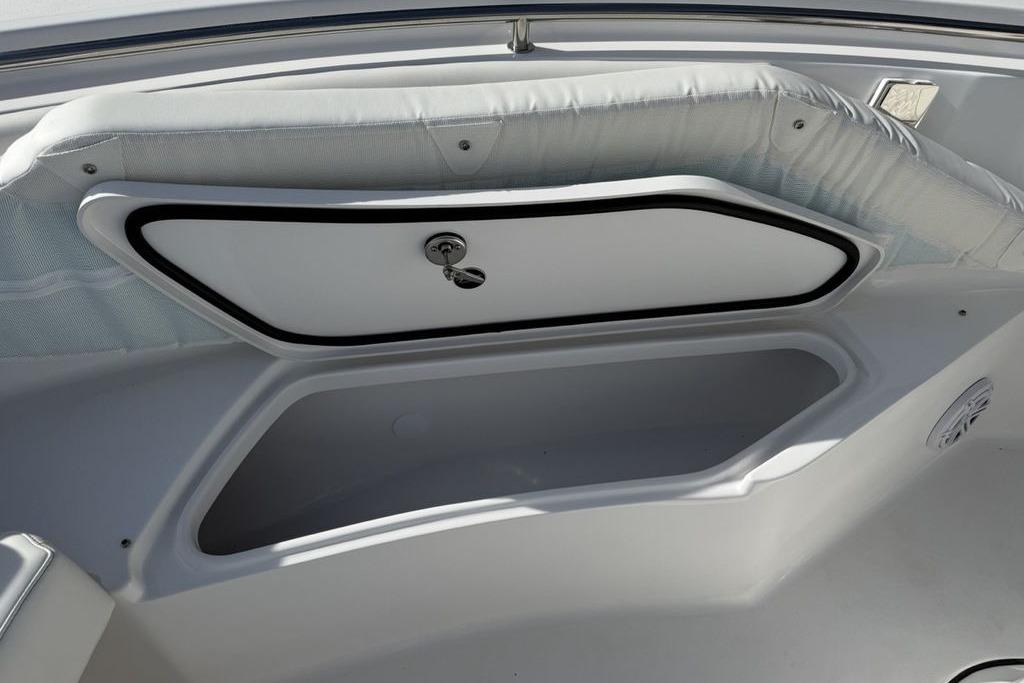 Storage compartment on 2026 Tidewater 232 LXF boat, featuring sleek design and secure latch.