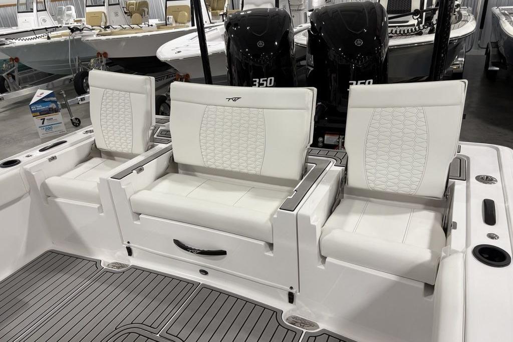 2026 Tidewater 3100 Carolina Bay boat with white cushioned seating and dual Yamaha 350 engines.