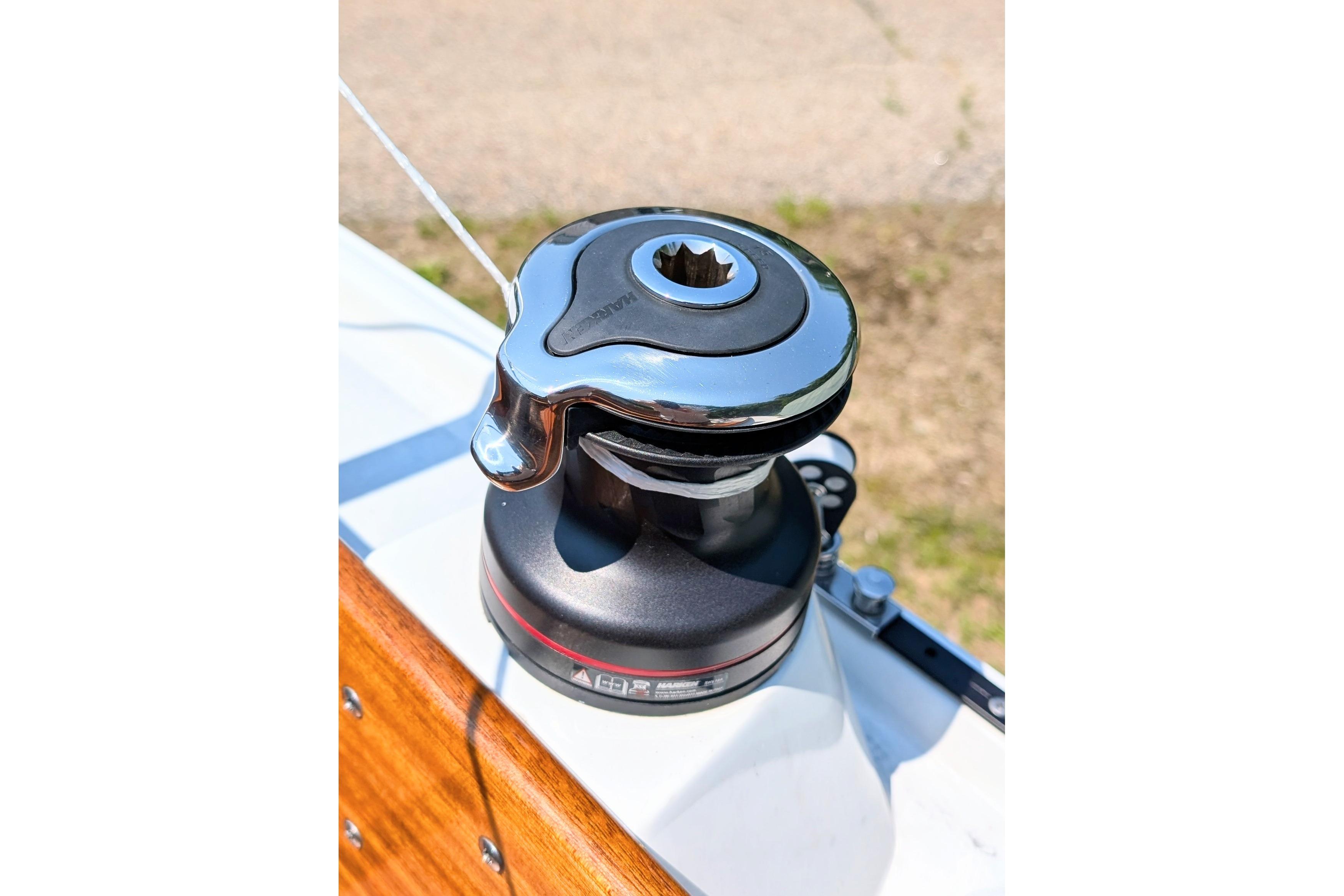 Chrome winch on a 1965 Pearson Ensign sailboat deck.