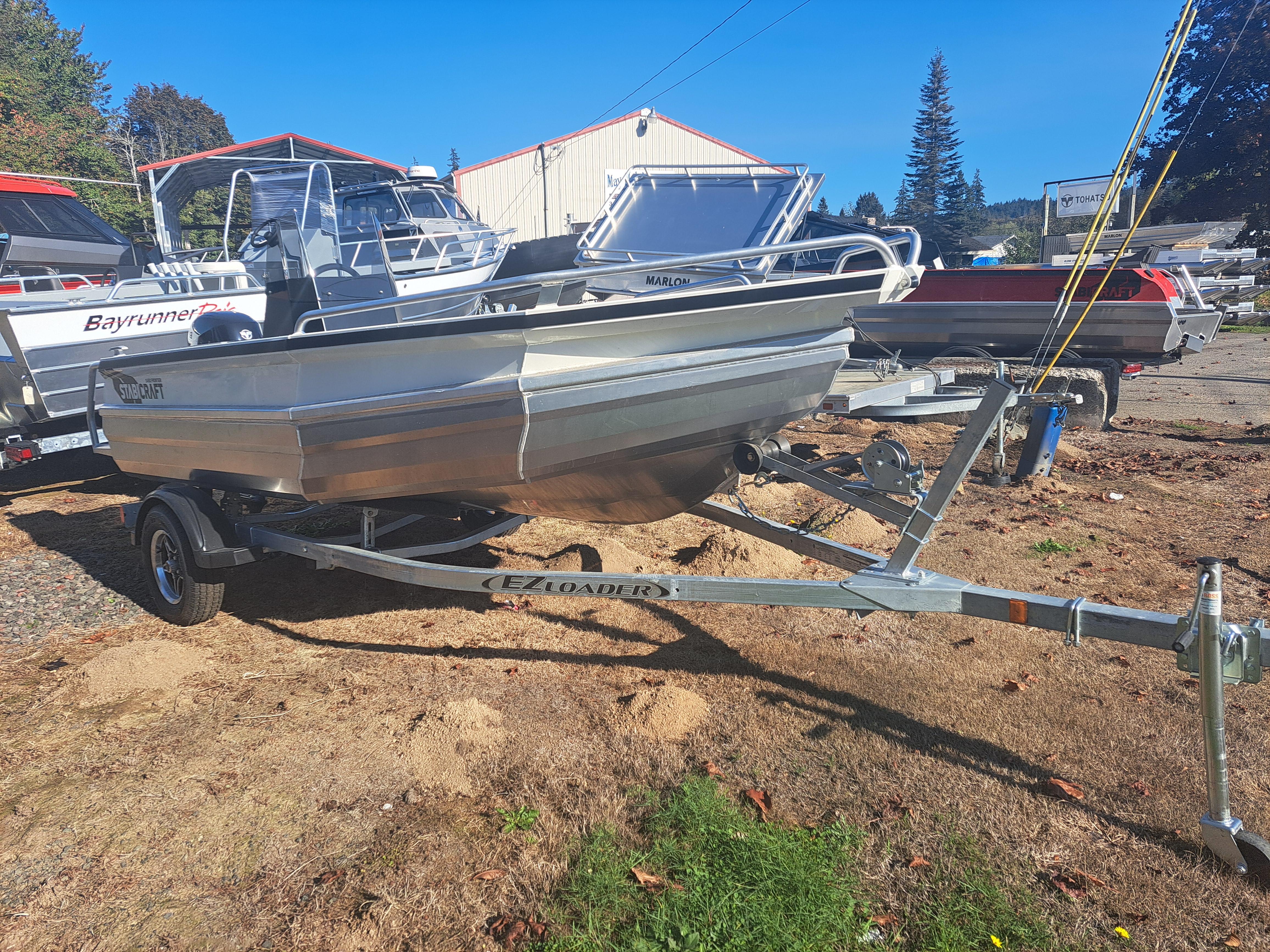 2024 Stabicraft 1450 Frontier boat on trailer in outdoor setting.