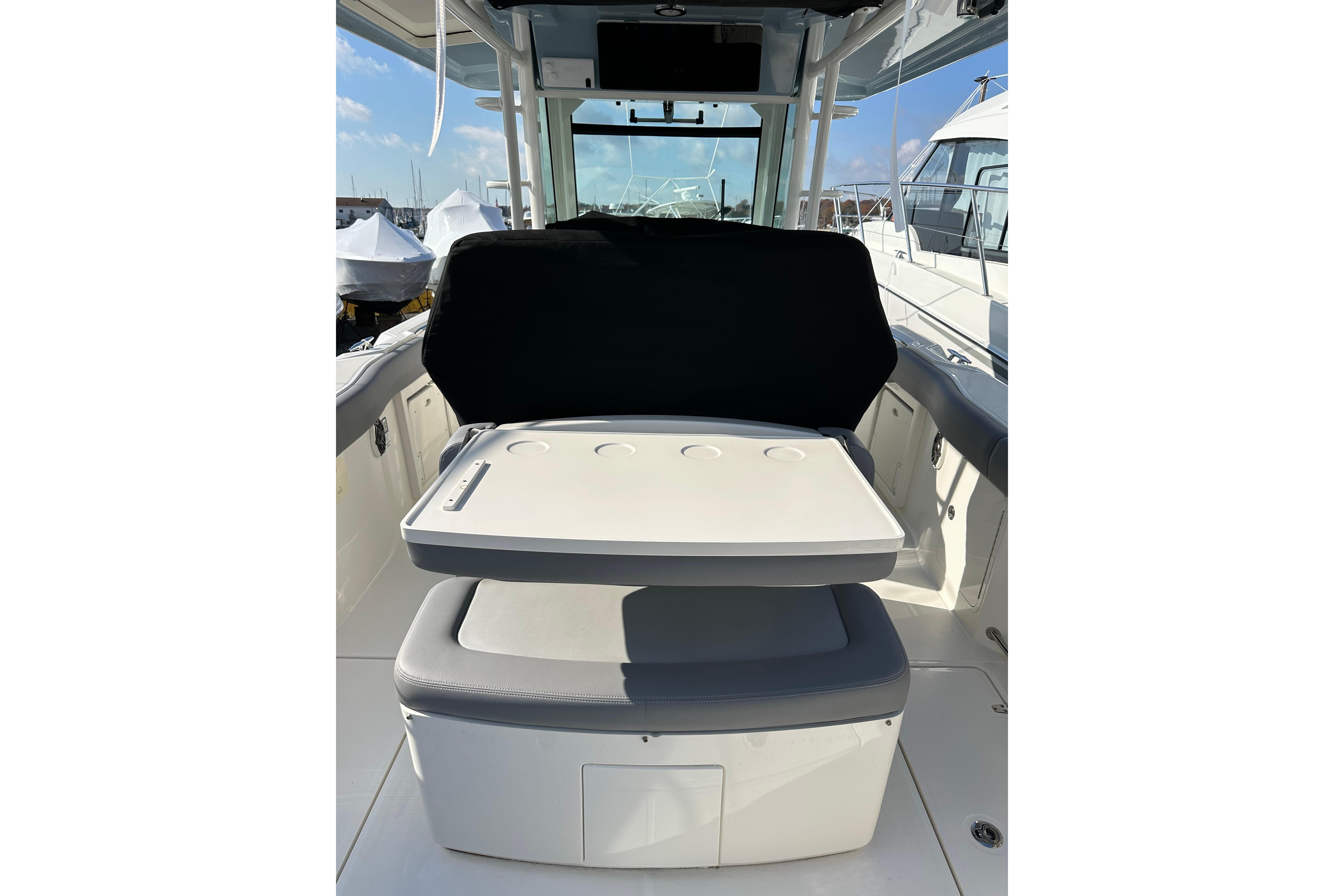 2023 Boston Whaler 330 Outrage boat interior with seating and storage.