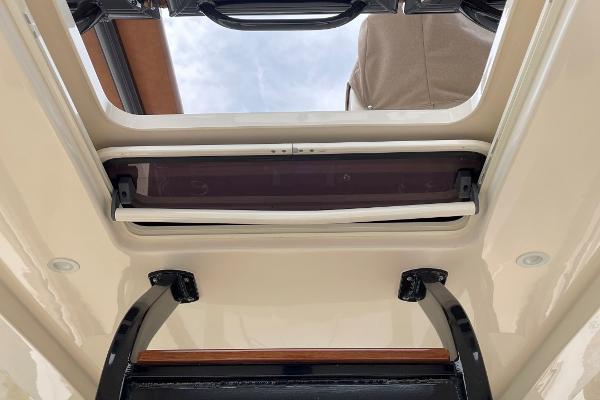 2020 Scout 420 LXF boat interior roof hatch with open sky view.