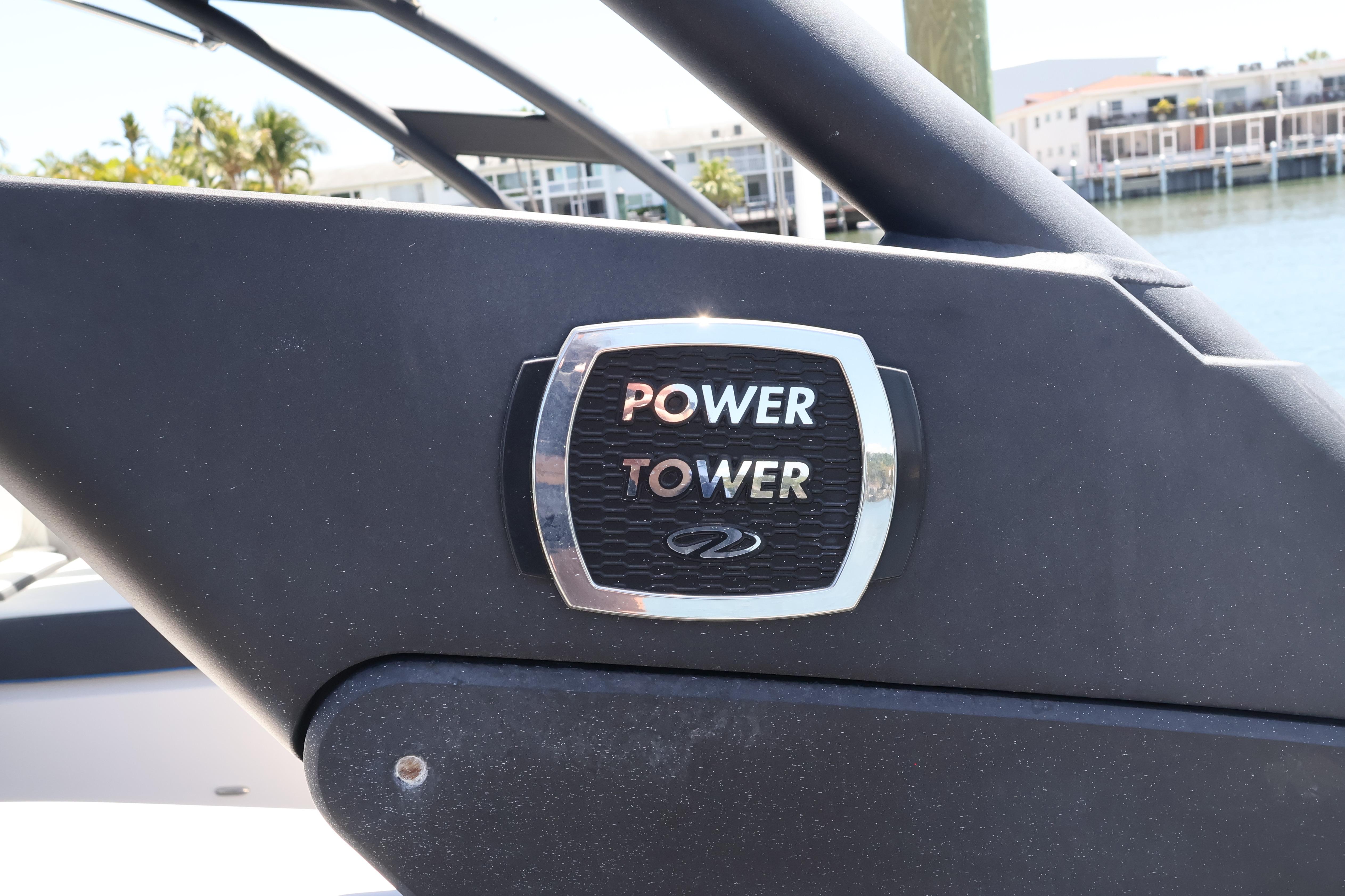 2020 Regal LX4 Power Tower emblem on a boat, with waterfront background.