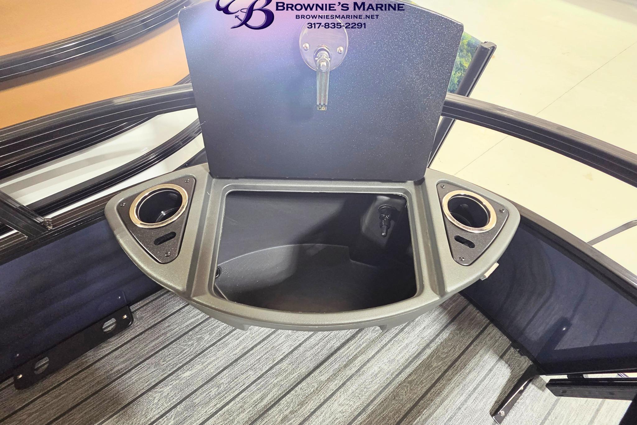2026 Ranger 220F boat storage compartment with cup holders, showcased by Brownie's Marine.