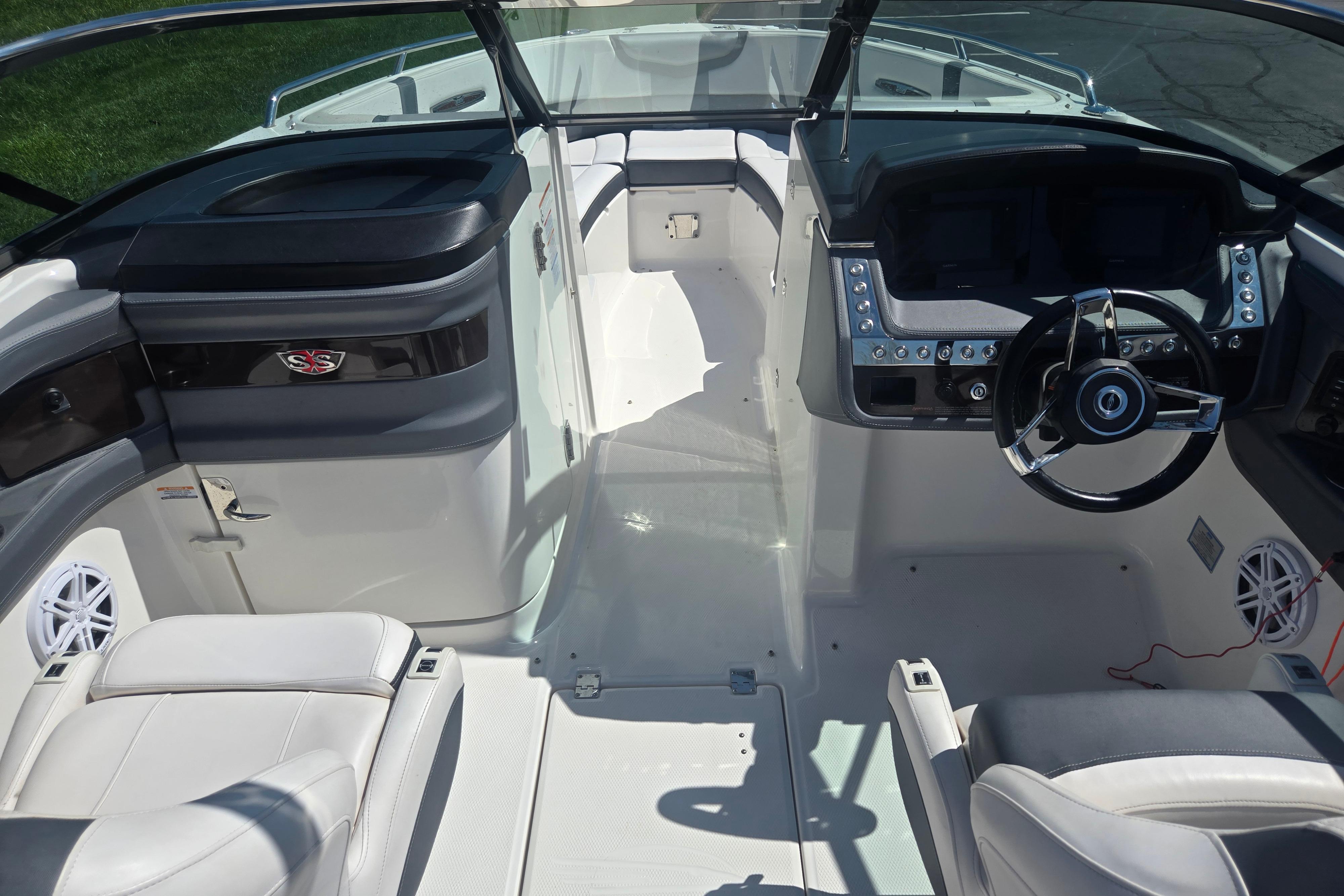 2018 Chaparral 267 SSX boat interior with sleek dashboard and comfortable seating.